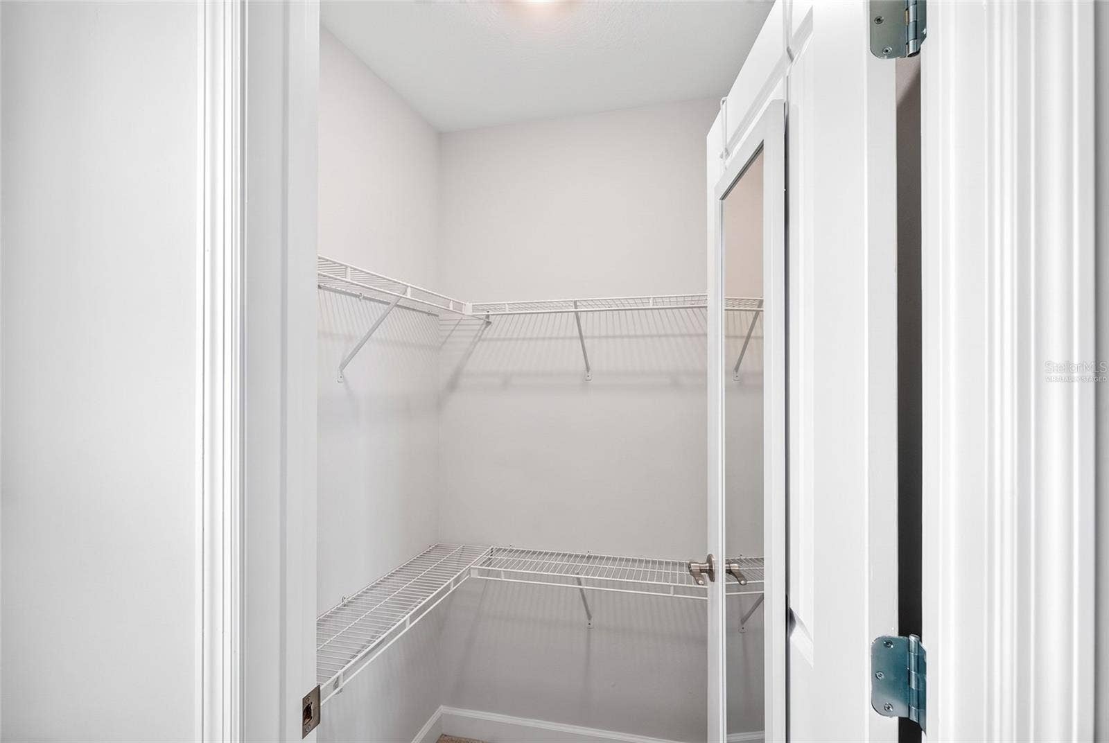 Upstairs 2nd bedroom closet virtually staged