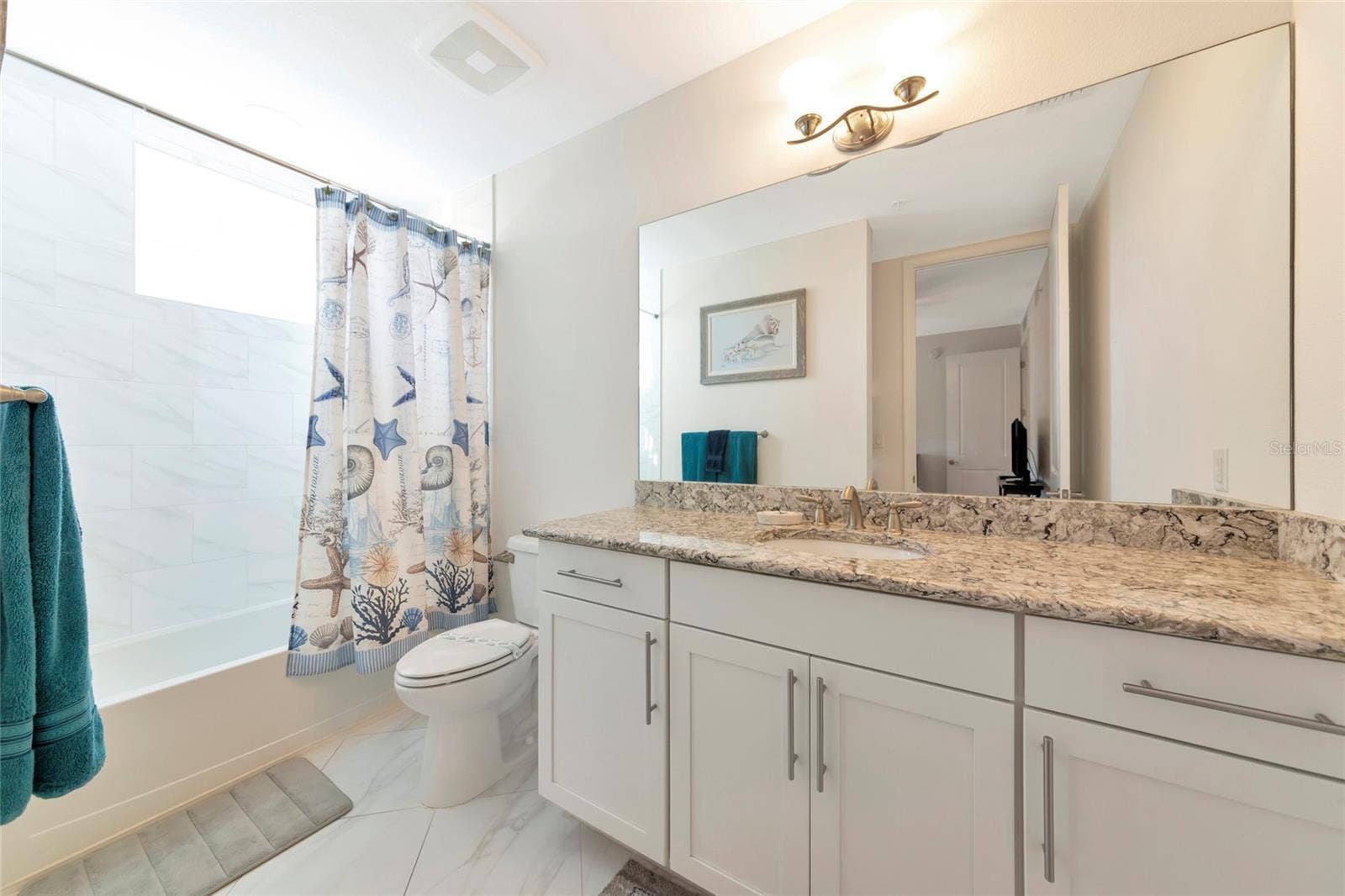 395 ARUBA CIRCLE, #203, Bradenton, FL 34209 second bedroom en suite with tub