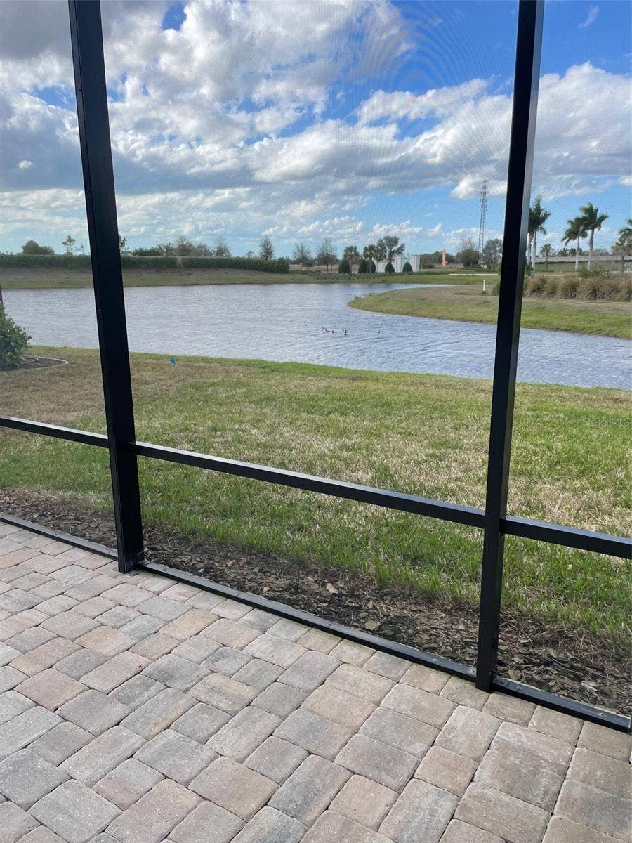 10434 SPRING TIDE WAY, Parrish, FL 34219 Enjoy water and nature views from your spacious lanai.