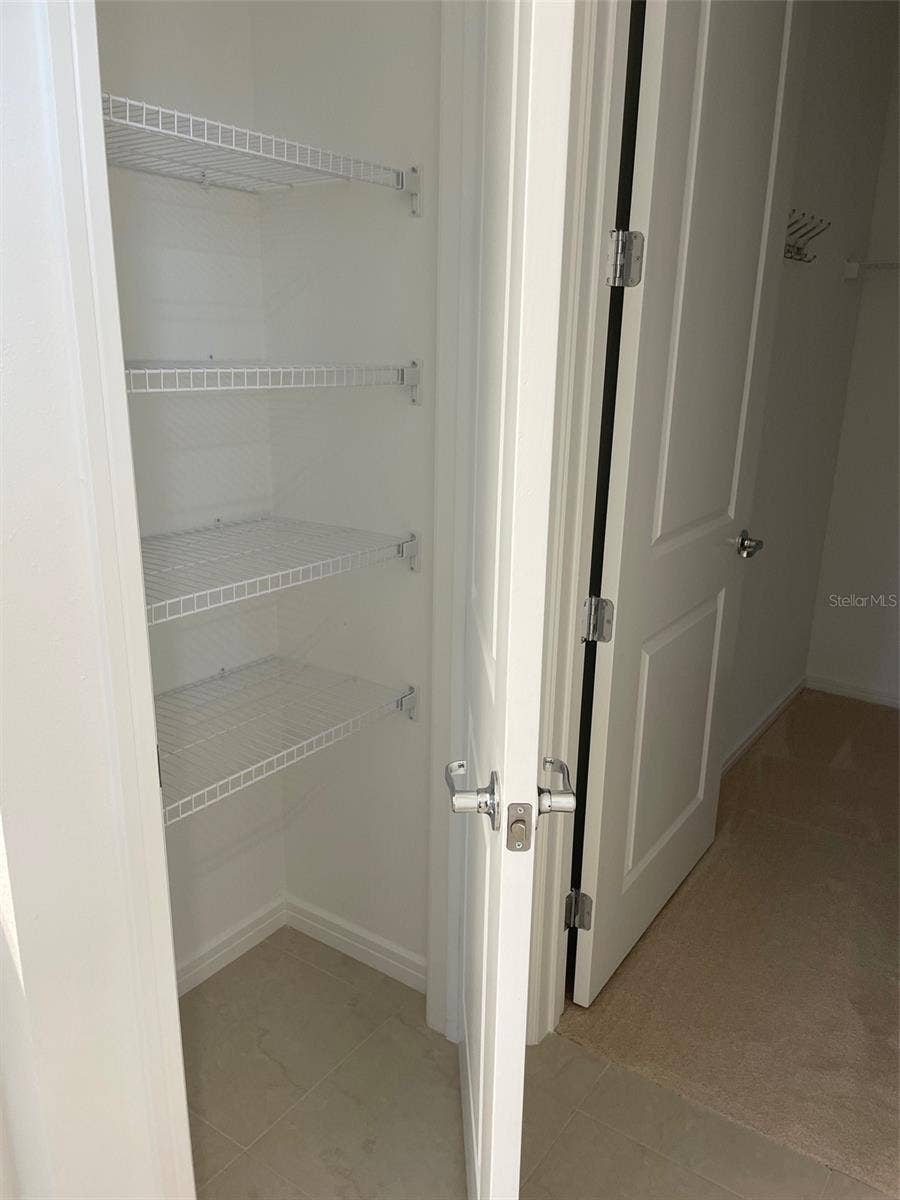 10434 SPRING TIDE WAY, Parrish, FL 34219 Linen closet in master bath