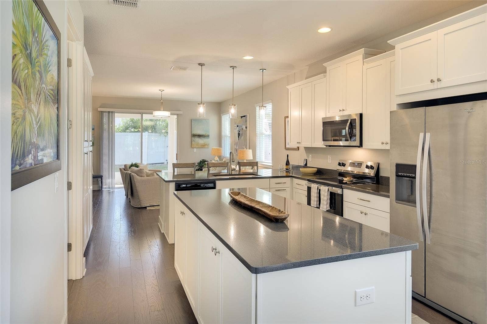 Great storage with 42" uppers, designer cabinetry, dbl pantry and island cabinets!
