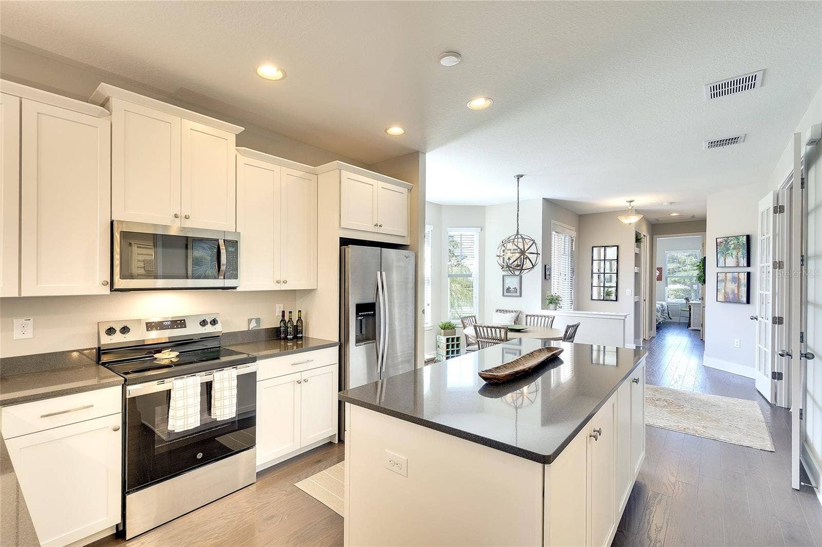 Quartz counters, stainless appliances, decorative lighting