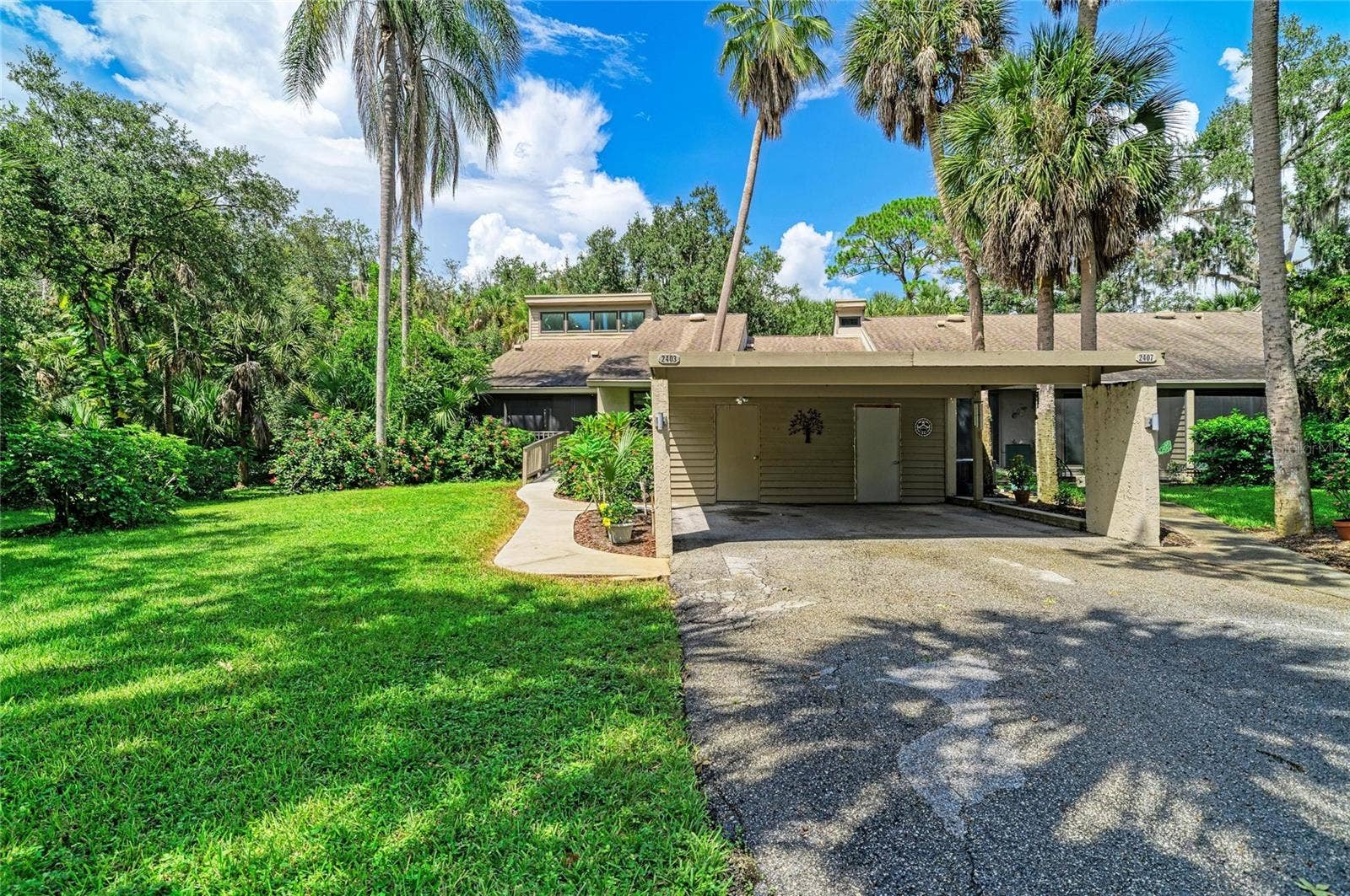 2403 ARBORETUM CIRCLE, #29, Sarasota, FL 34232 Carport with storage inside