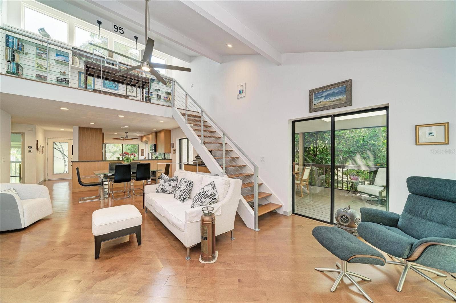 2403 ARBORETUM CIRCLE, #29, Sarasota, FL 34232 Open floor plan with living/dining, stairs to the loft and kitchen under the loft.