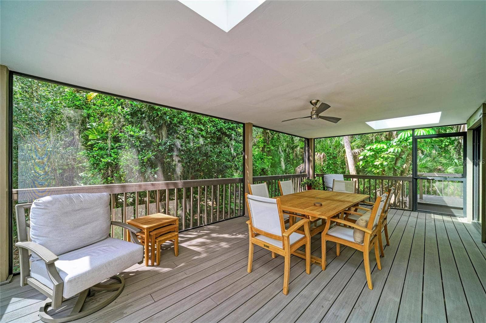 2403 ARBORETUM CIRCLE, #29, Sarasota, FL 34232 Covered & Screened lanai with skylights. Door goes to the open air deck.