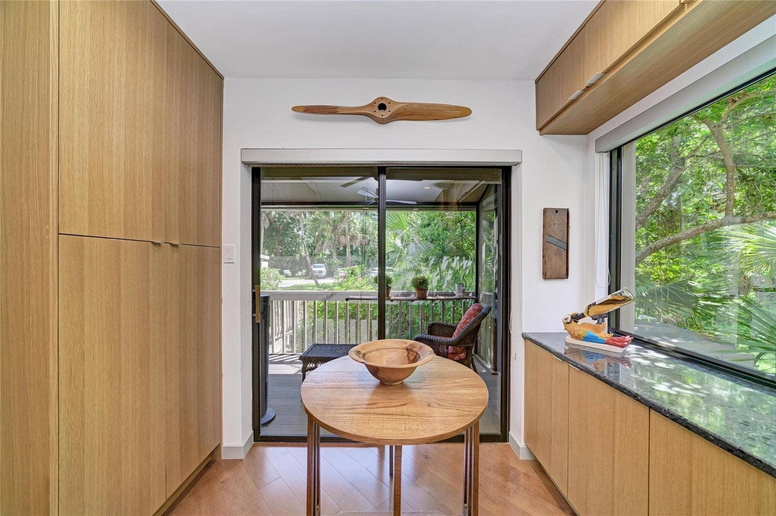 2403 ARBORETUM CIRCLE, #29, Sarasota, FL 34232 Washer/dryer and pantry in the closets to the left. And another large window looking out at your tropical oasis.
