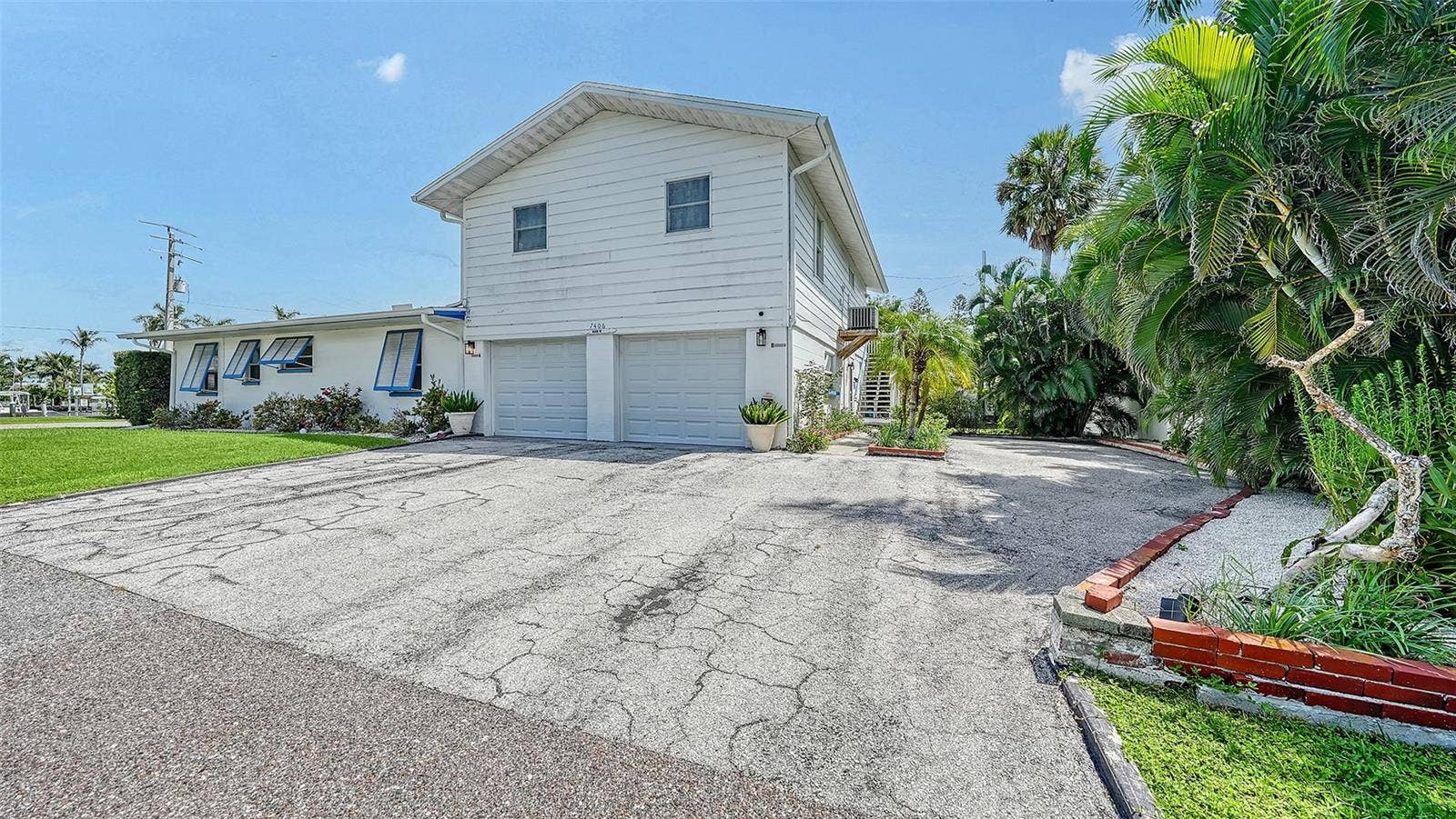 7406 MARINA DRIVE, #A and B, Holmes Beach, FL 34217 2 car garage for Apt A with side uncovered parking for Apt B