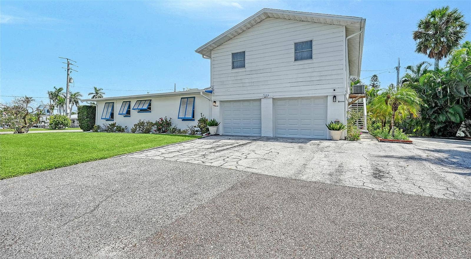 7406 MARINA DRIVE, #A and B, Holmes Beach, FL 34217 2 car garage for Apt A with side uncovered parking for Apt B