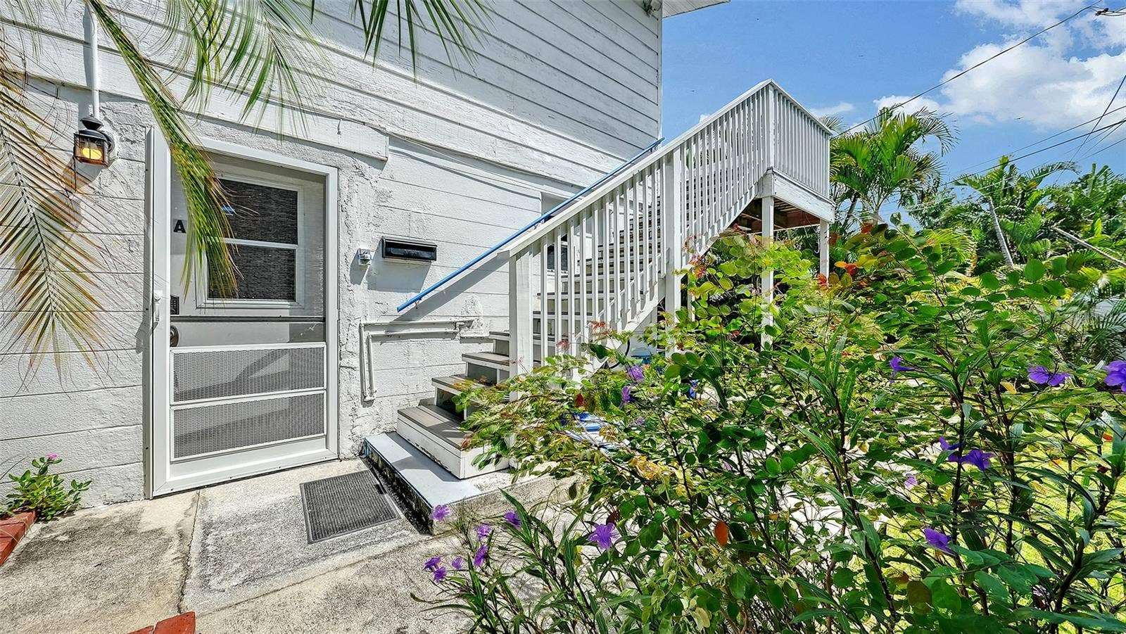 7406 MARINA DRIVE, #A and B, Holmes Beach, FL 34217 Side entrance up the stairs to Apt B