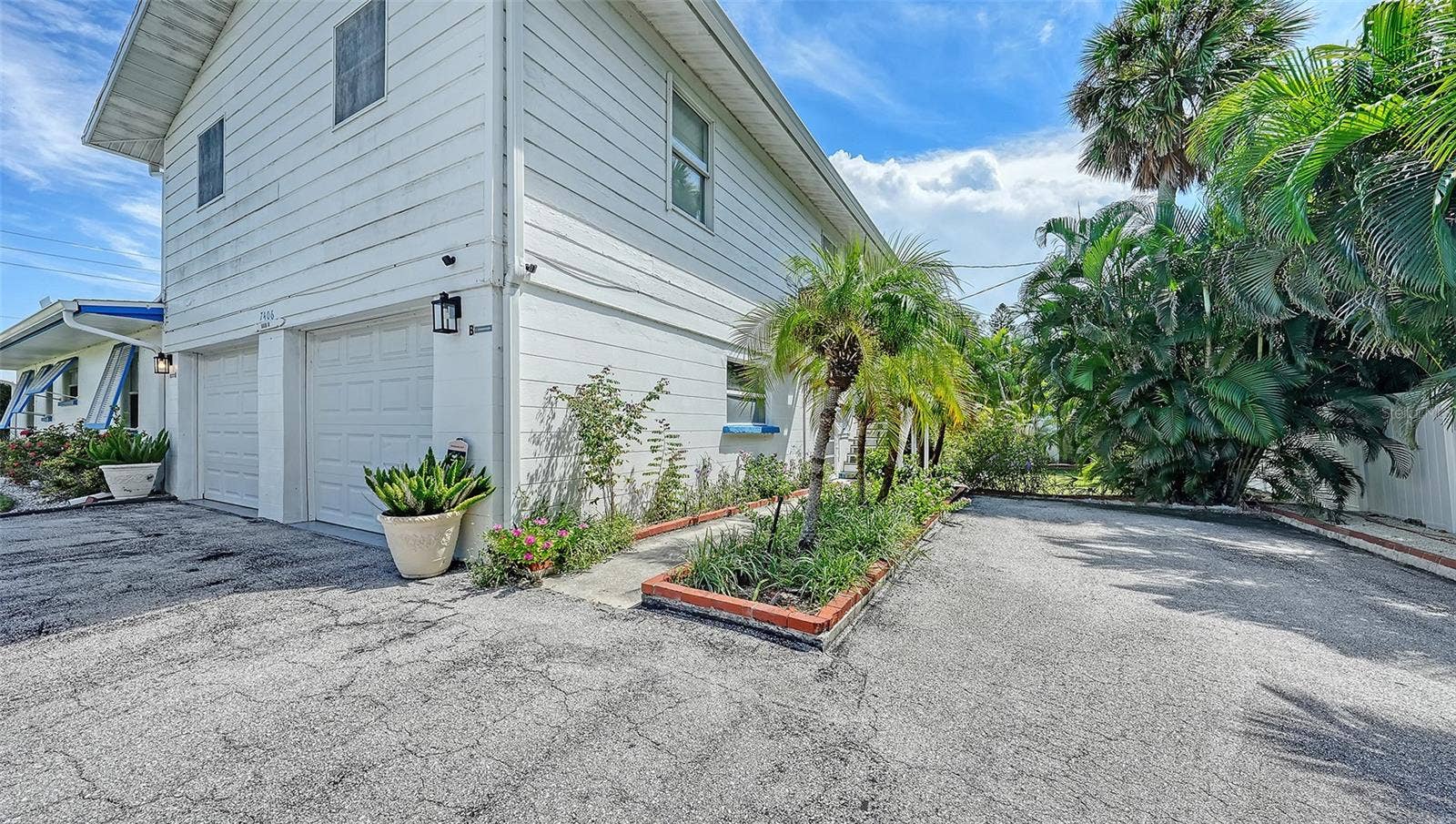 7406 MARINA DRIVE, #A and B, Holmes Beach, FL 34217 2 car garage for Apt A with side uncovered parking for Apt B