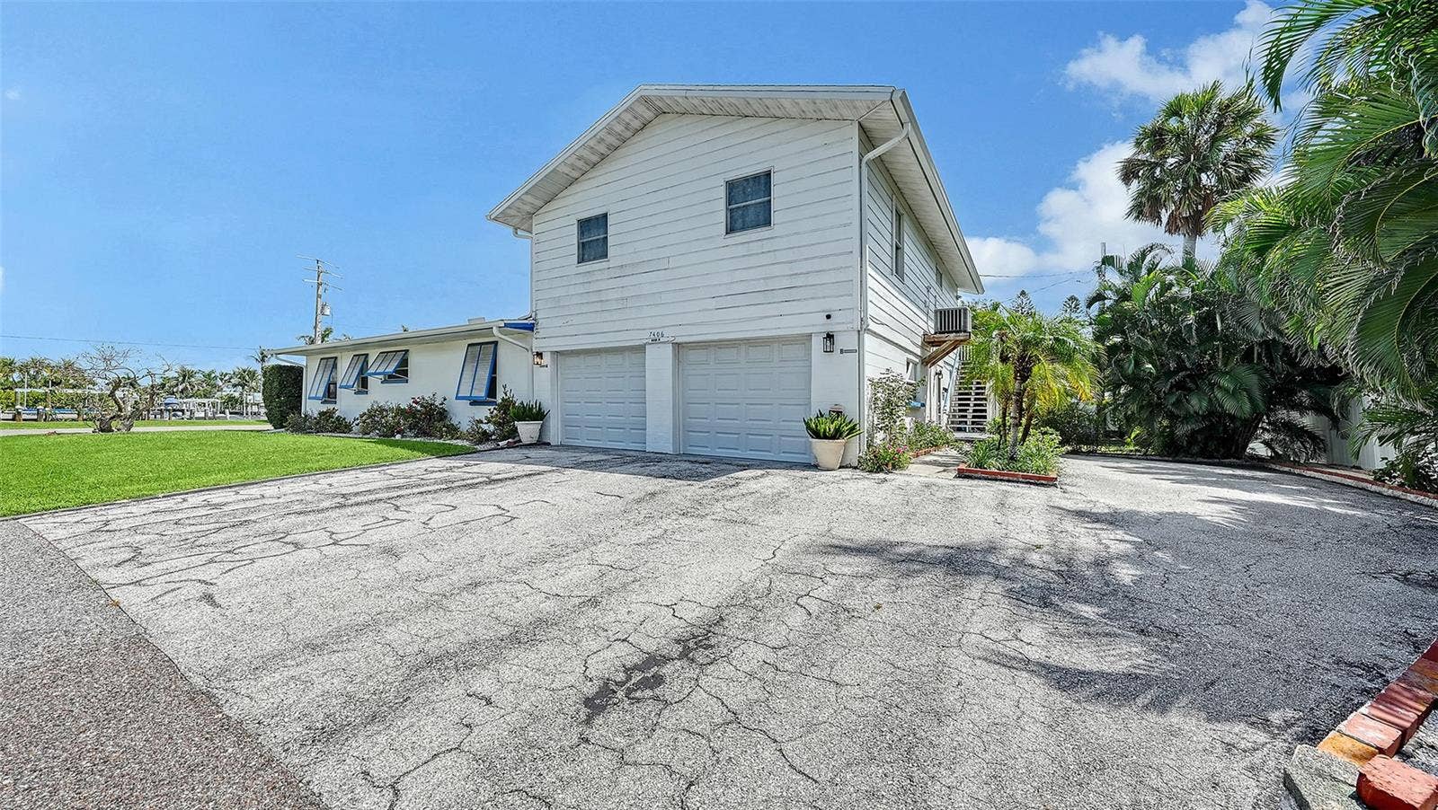 7406 MARINA DRIVE, #A and B, Holmes Beach, FL 34217 2 car garage for Apt A with side uncovered parking for Apt B