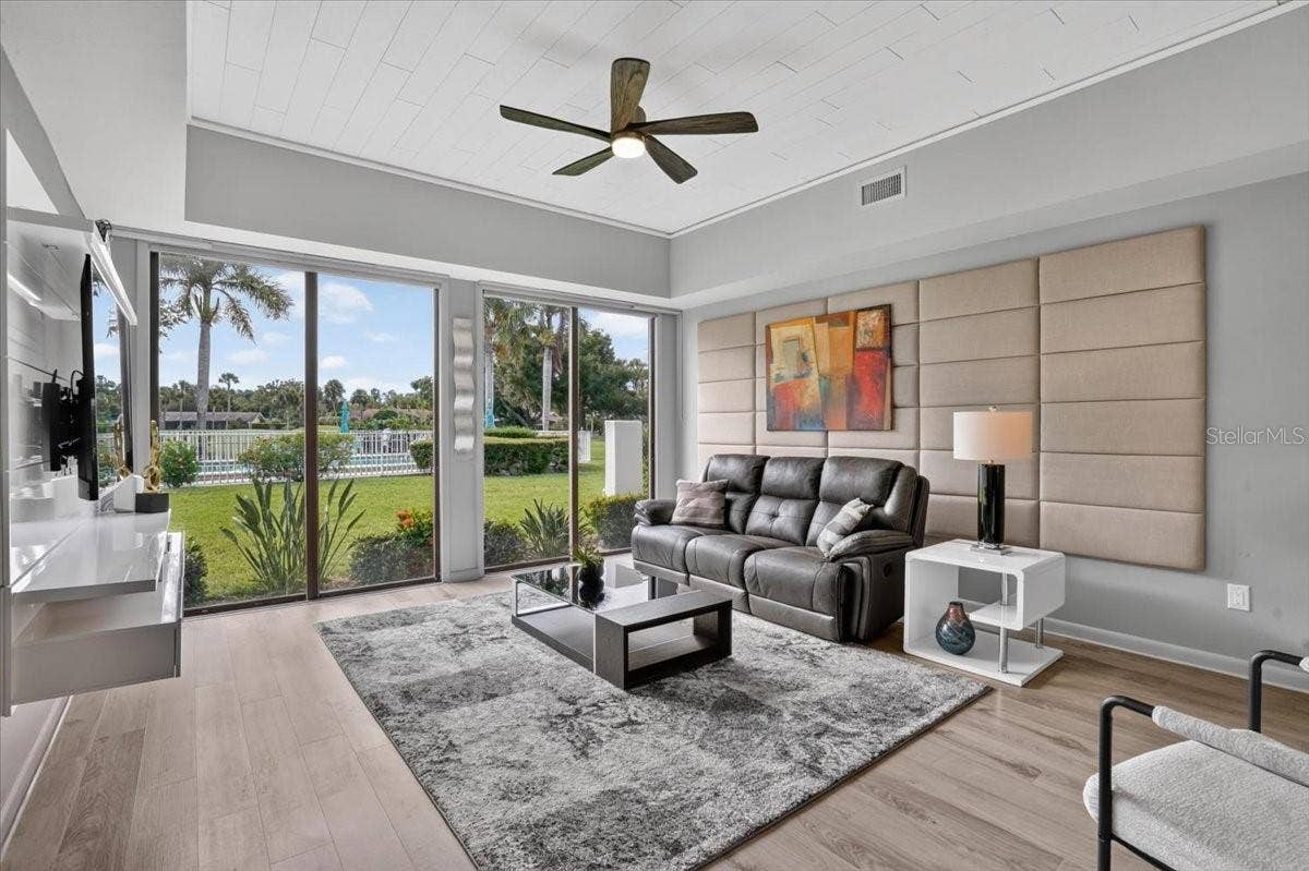 2319 LAKESIDE MEWS, #B3, Sarasota, FL 34235 living room with sliding glass doors