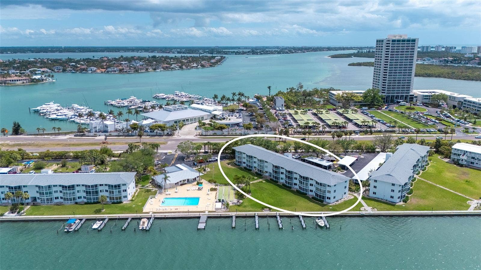 Aerial shot of exterior building. Sarasota Yacht Club directly across the street.