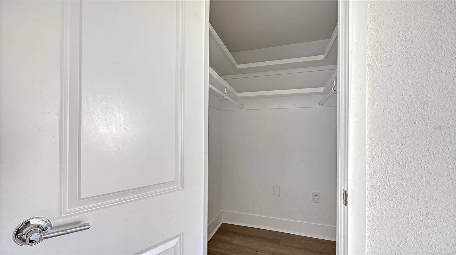 Primary Bedroom (bedroom one) walk-in closet.