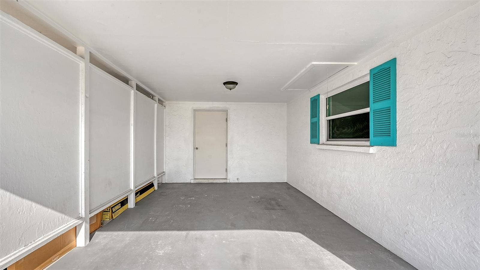 Carport with storage room.