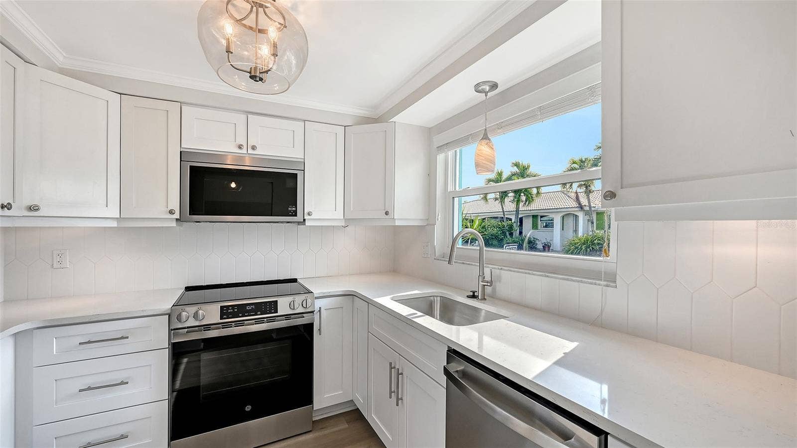 New Kitchen with stone countertops and stainless steel appliances.