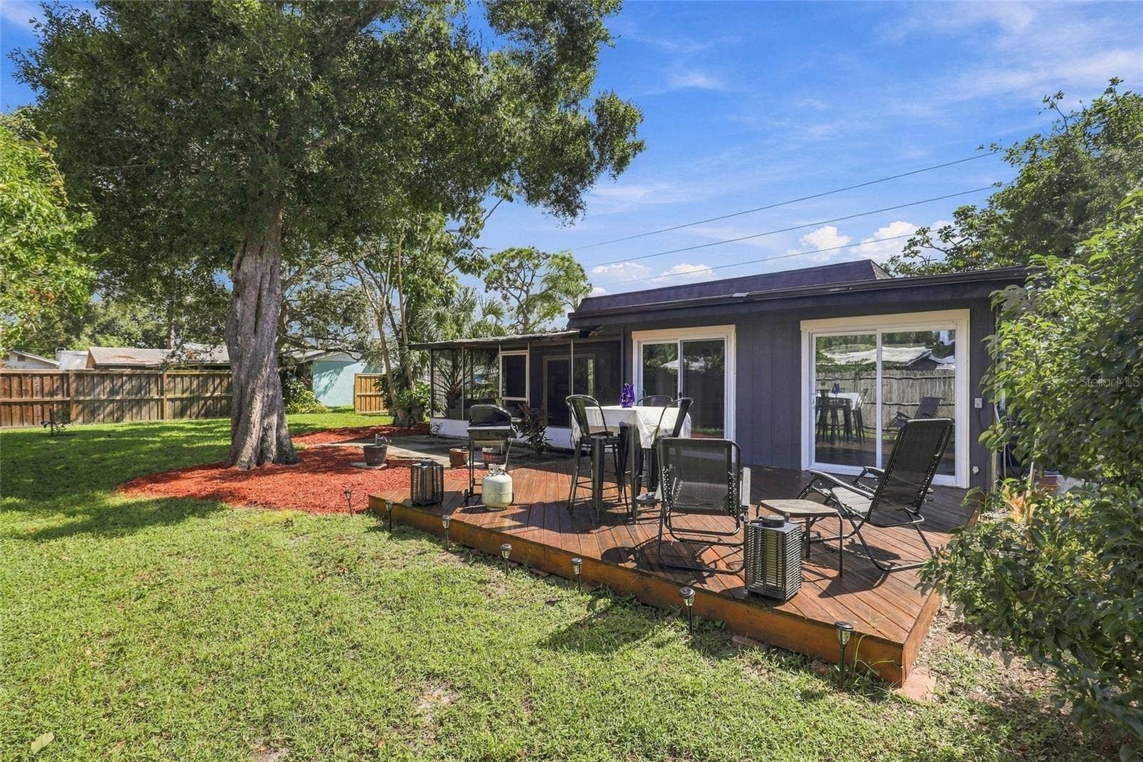 Spacious Backyard with a Charming Porch, Perfect for Relaxing and Enjoying the Outdoors