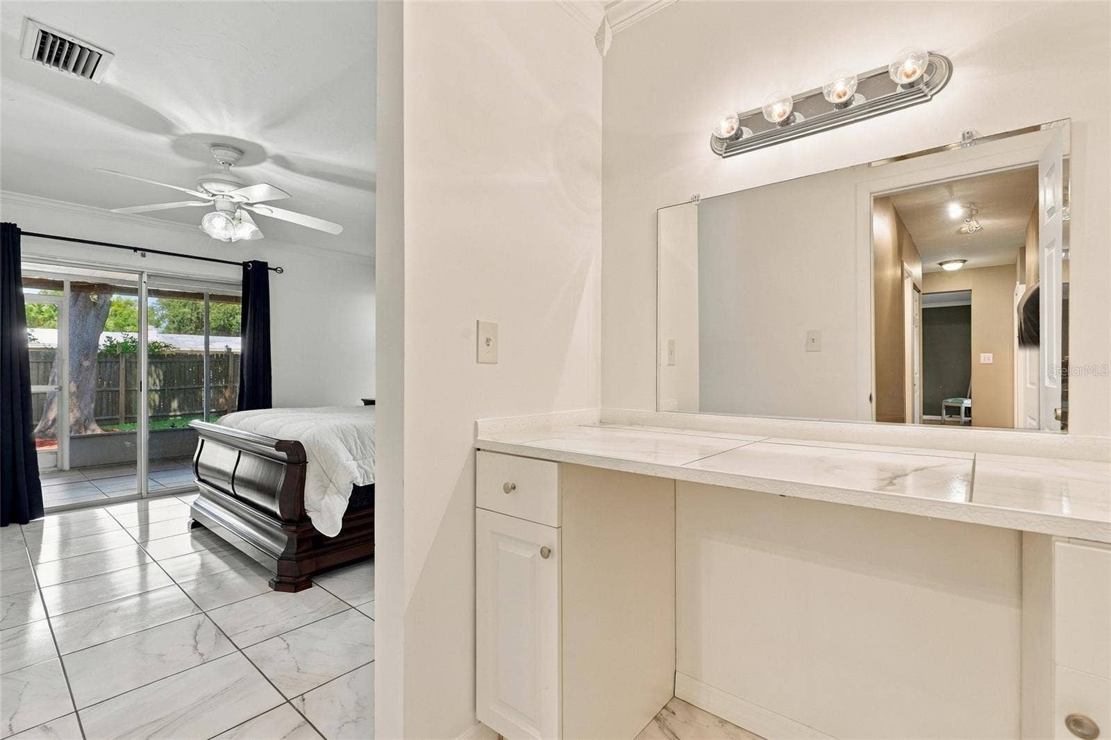 Convenient Makeup Vanity in the Primary Bedroom for Added Comfort and Functionality