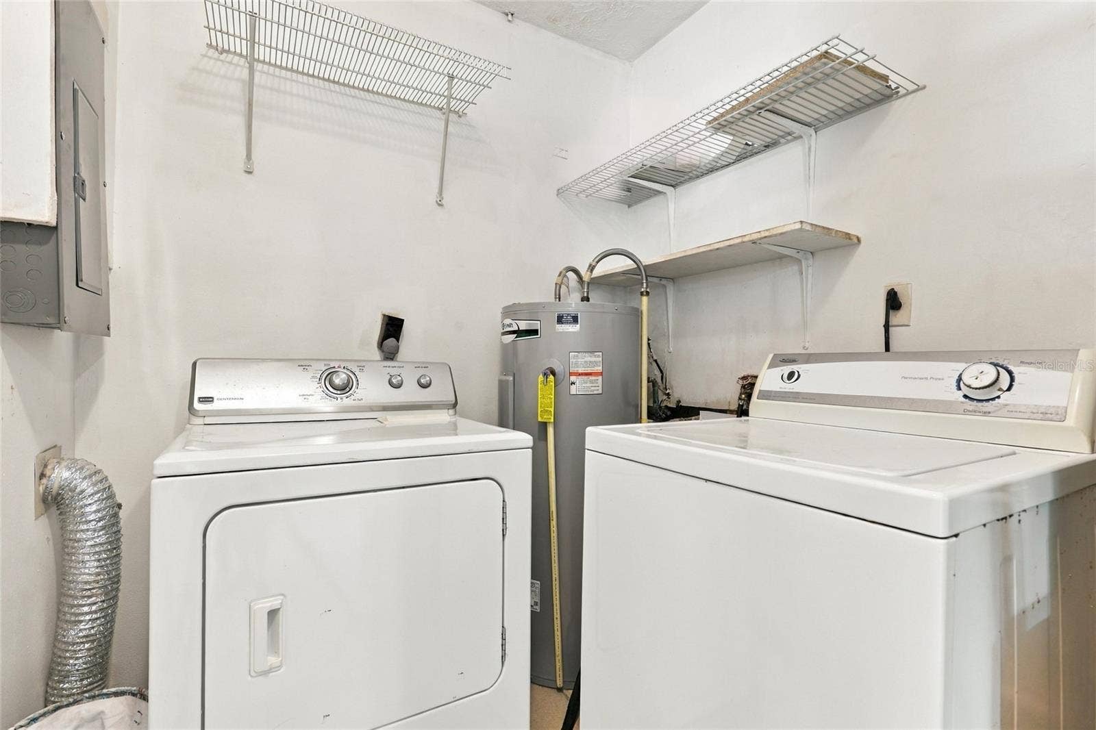 Convenient Indoor Laundry Room with Dedicated Space for Everyday Essentials