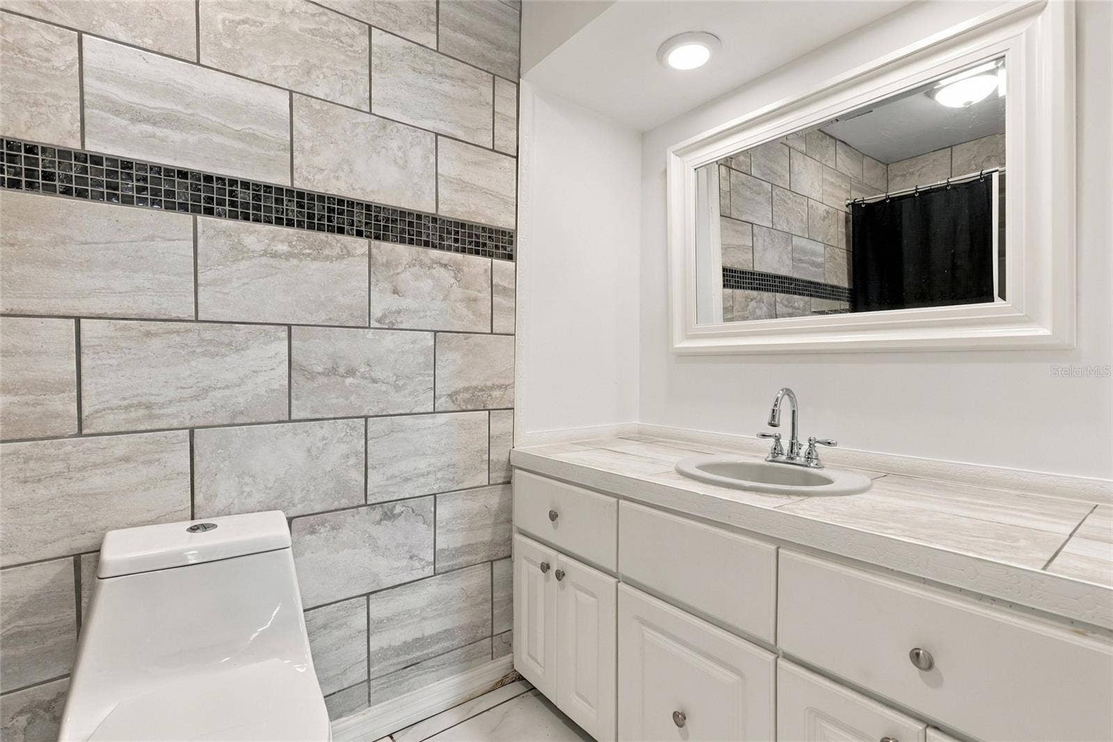 Private Ensuite Bathroom Conveniently Located Off the Primary Bedroom