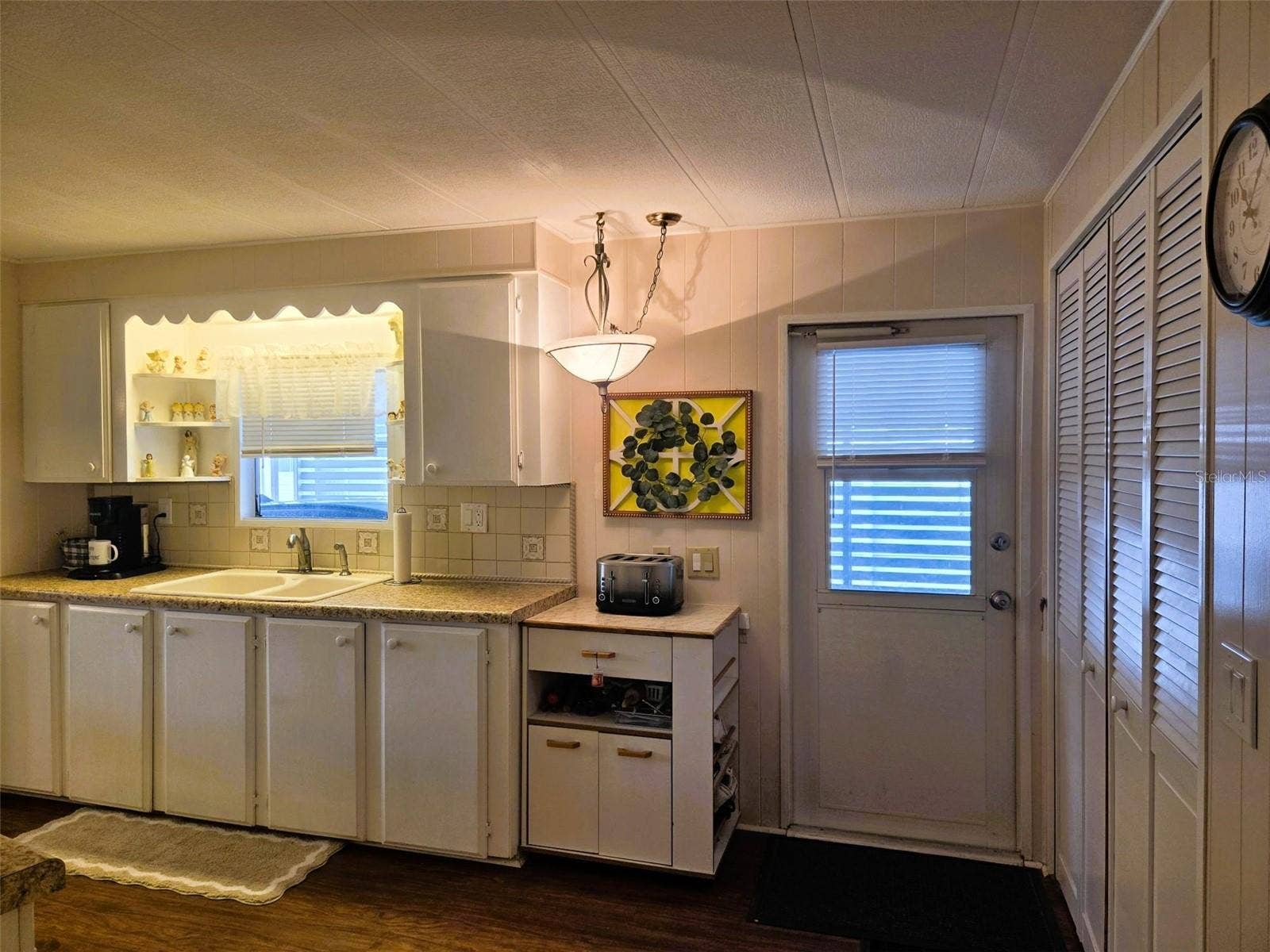 3309 OAKWOOD BOULEVARD N, Sarasota, FL 34237 Door out the kitchen area to carport
