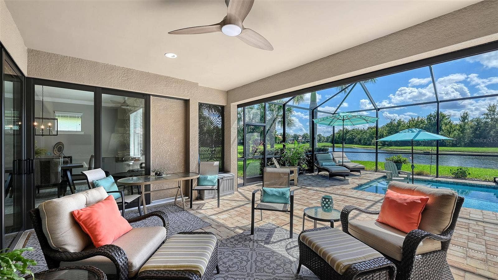 6827 GOSPORT COVE, Bradenton, FL 34202 Step into your own outdoor oasis, where covered seating, a well-appointed outdoor kitchen, and breathtaking views create the perfect backdrop for Florida living.