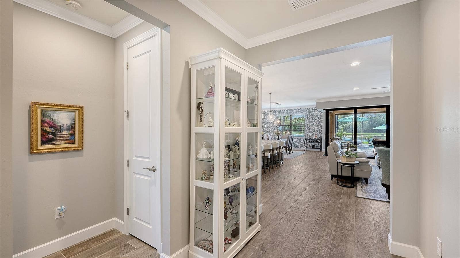 6827 GOSPORT COVE, Bradenton, FL 34202 A gracious entrance welcomes you into this exceptional home, setting the tone for the inviting spaces that await within.