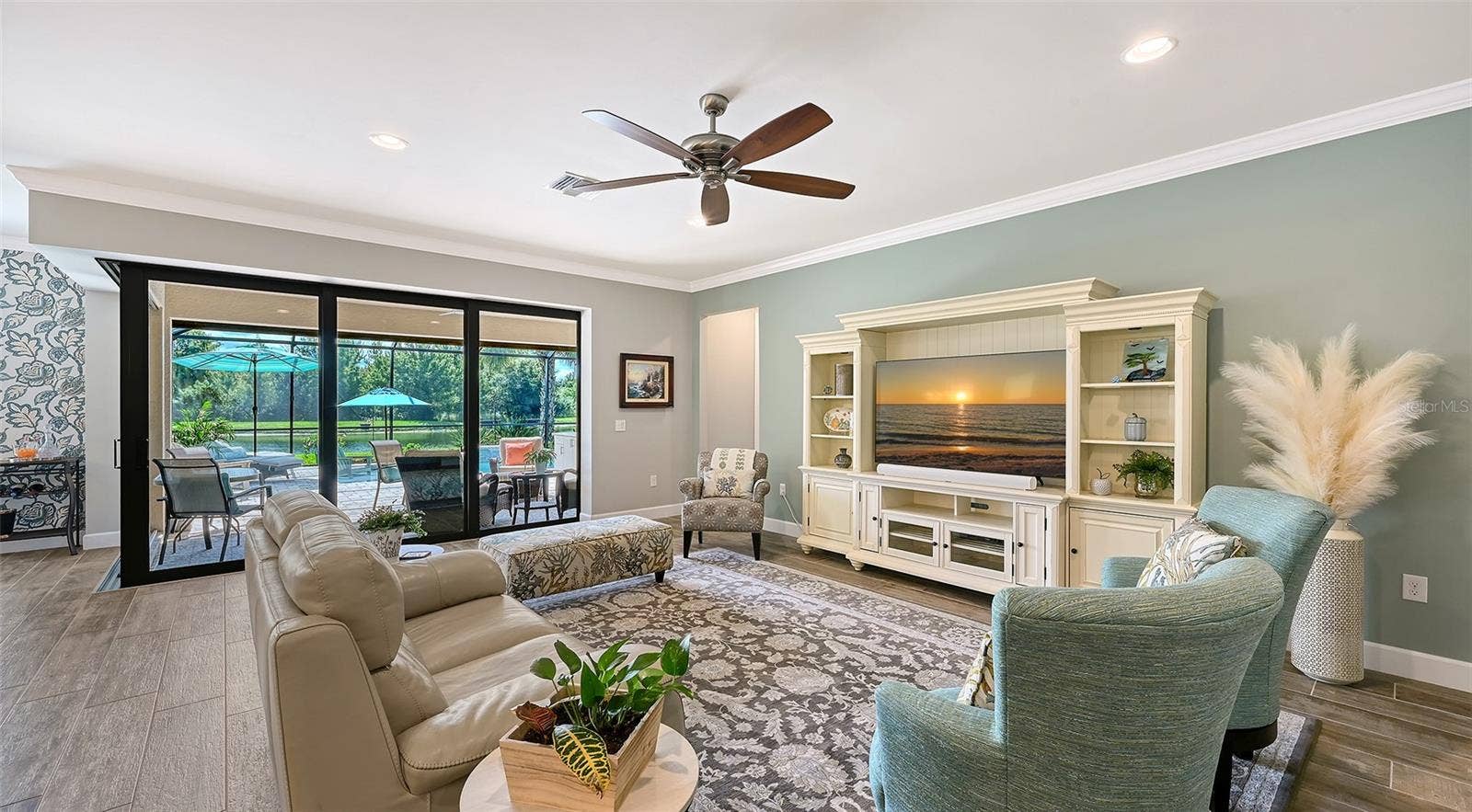 6827 GOSPORT COVE, Bradenton, FL 34202 This inviting great room provides the perfect setting to unwind, relax, and enjoy the comfort of this exceptional home.