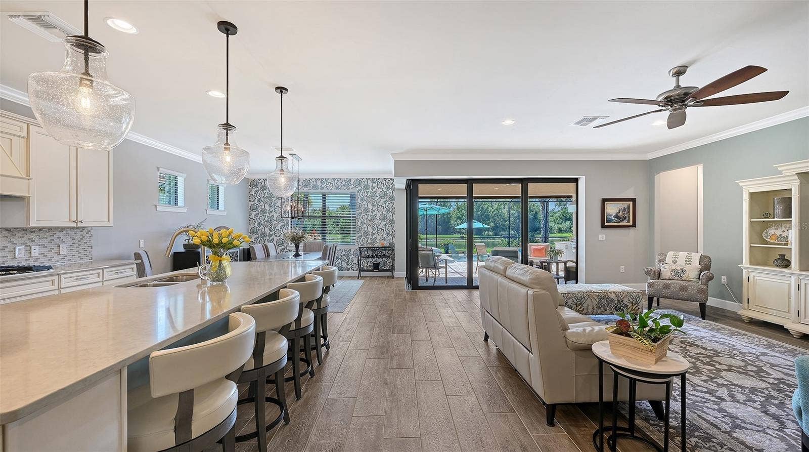 6827 GOSPORT COVE, Bradenton, FL 34202 Step inside to discover an inviting great room and stunning kitchen gathering area, thoughtfully designed for everyday comfort and effortless entertaining.