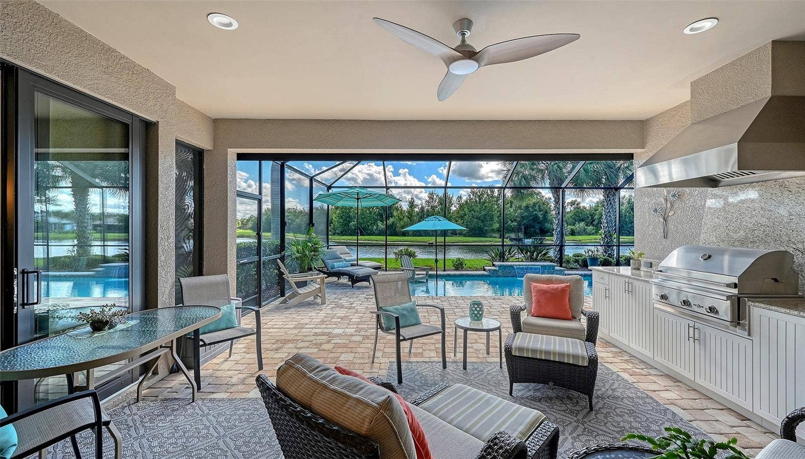 6827 GOSPORT COVE, Bradenton, FL 34202 Where luxury living meets outdoor living with an appointed outdoor kithchen, propane grill and a beverage refrigerator for your convenience.