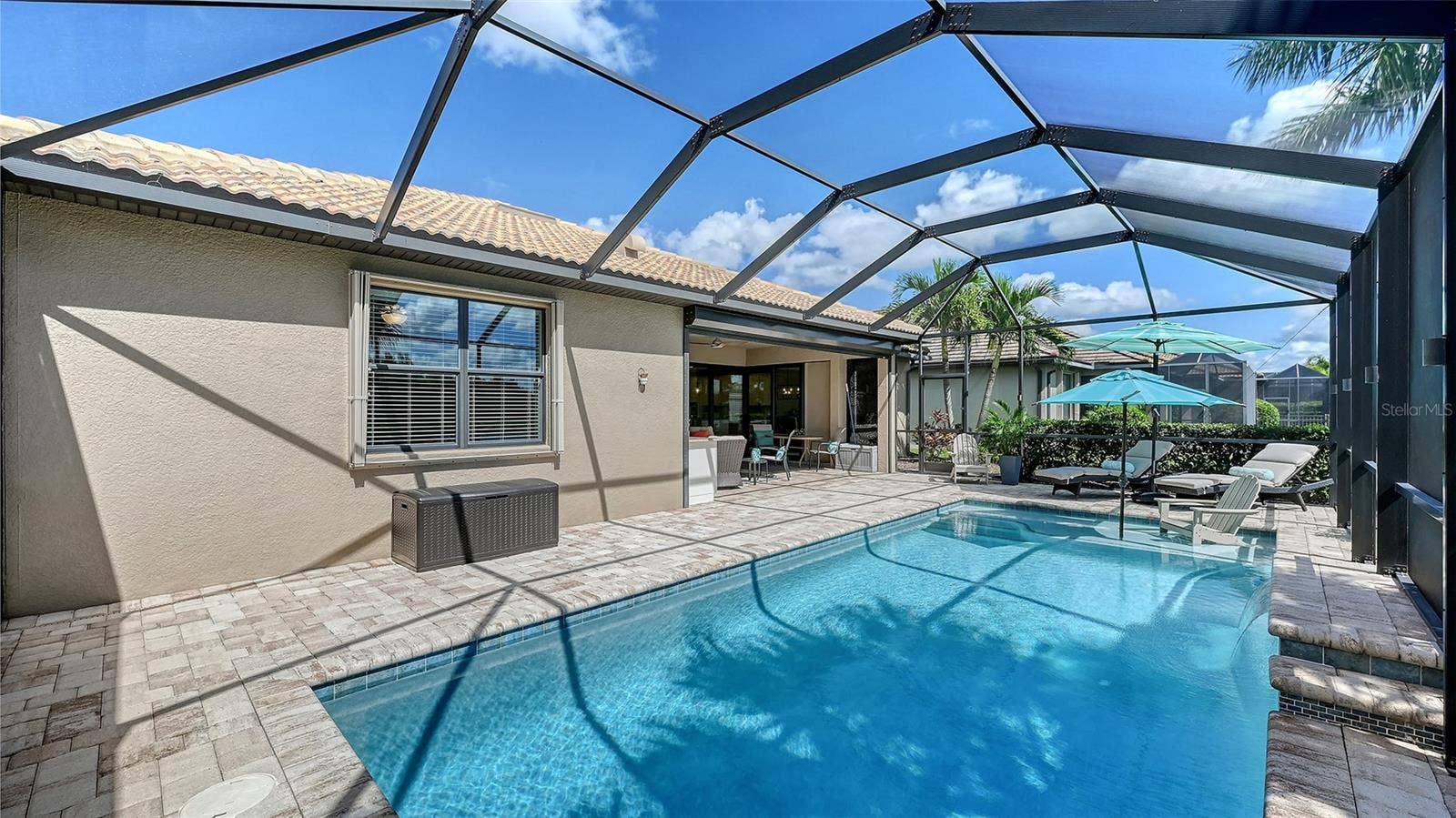 6827 GOSPORT COVE, Bradenton, FL 34202 Enjoy leisurely afternoons lounging beneath the covered lanai.