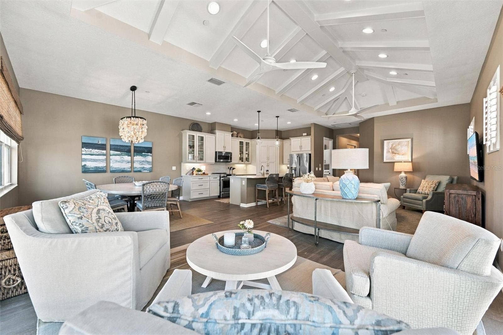 291 COMPASS POINT DRIVE, #201, Bradenton, FL 34209 Enjoy peaceful Sapphire Lake views from this beautifully appointed home, featuring an open-concept floor plan, soaring vaulted ceilings, and Mohawk engineered hardwood flooring.