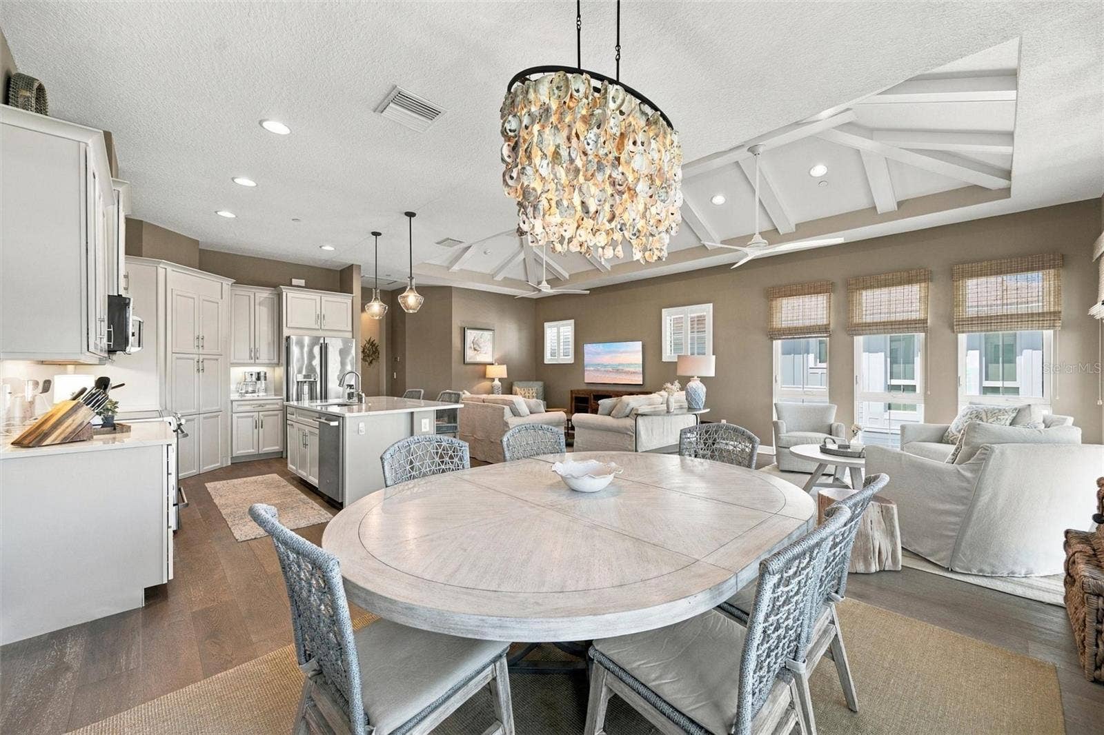 291 COMPASS POINT DRIVE, #201, Bradenton, FL 34209 Enjoy peaceful Sapphire Lake views from this beautifully appointed home, featuring an open-concept floor plan, soaring vaulted ceilings, and Mohawk engineered hardwood flooring.
