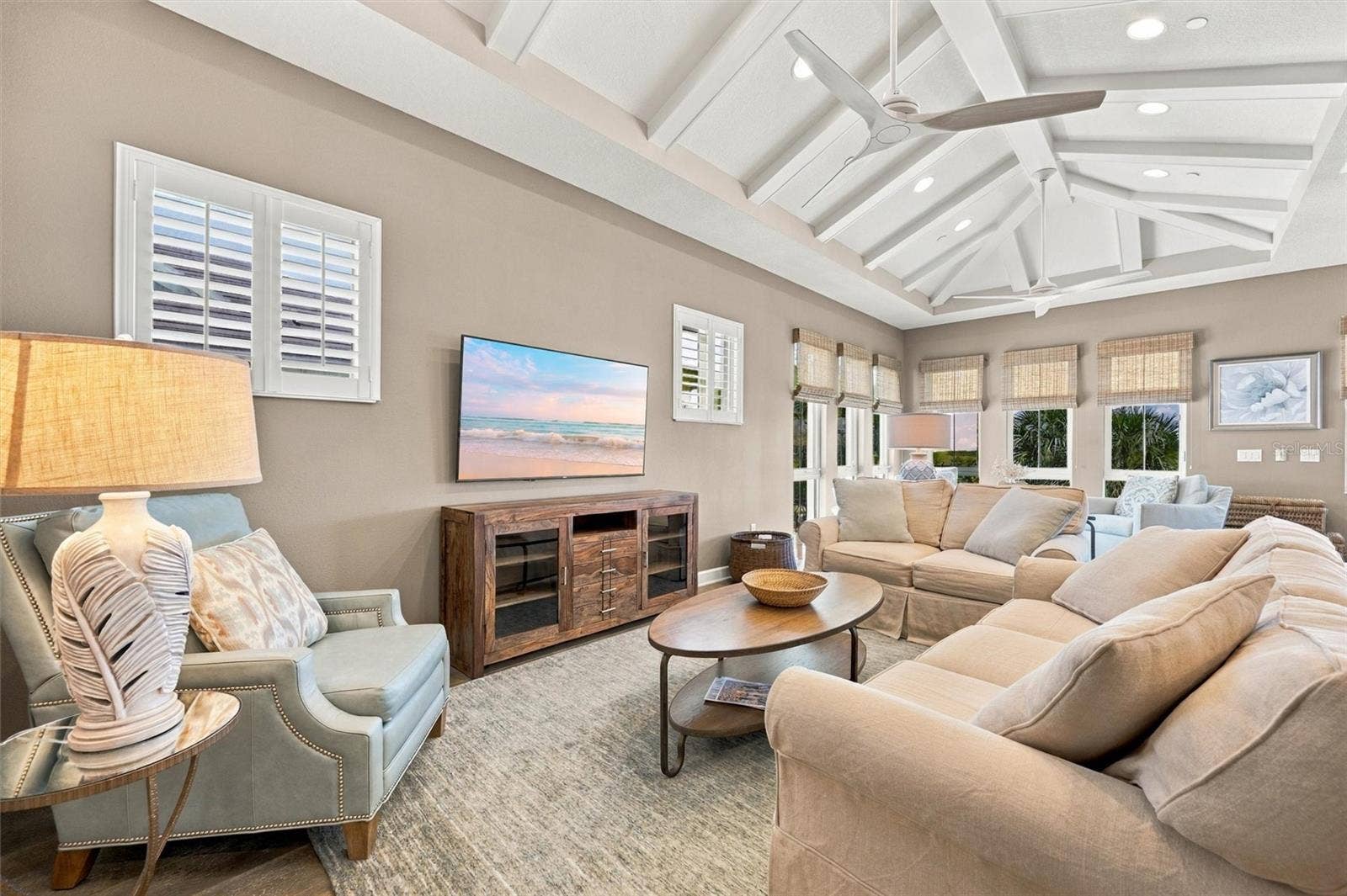 291 COMPASS POINT DRIVE, #201, Bradenton, FL 34209 Enjoy peaceful Sapphire Lake views from this beautifully appointed home, featuring an open-concept floor plan, soaring vaulted ceilings, and Mohawk engineered hardwood flooring.
