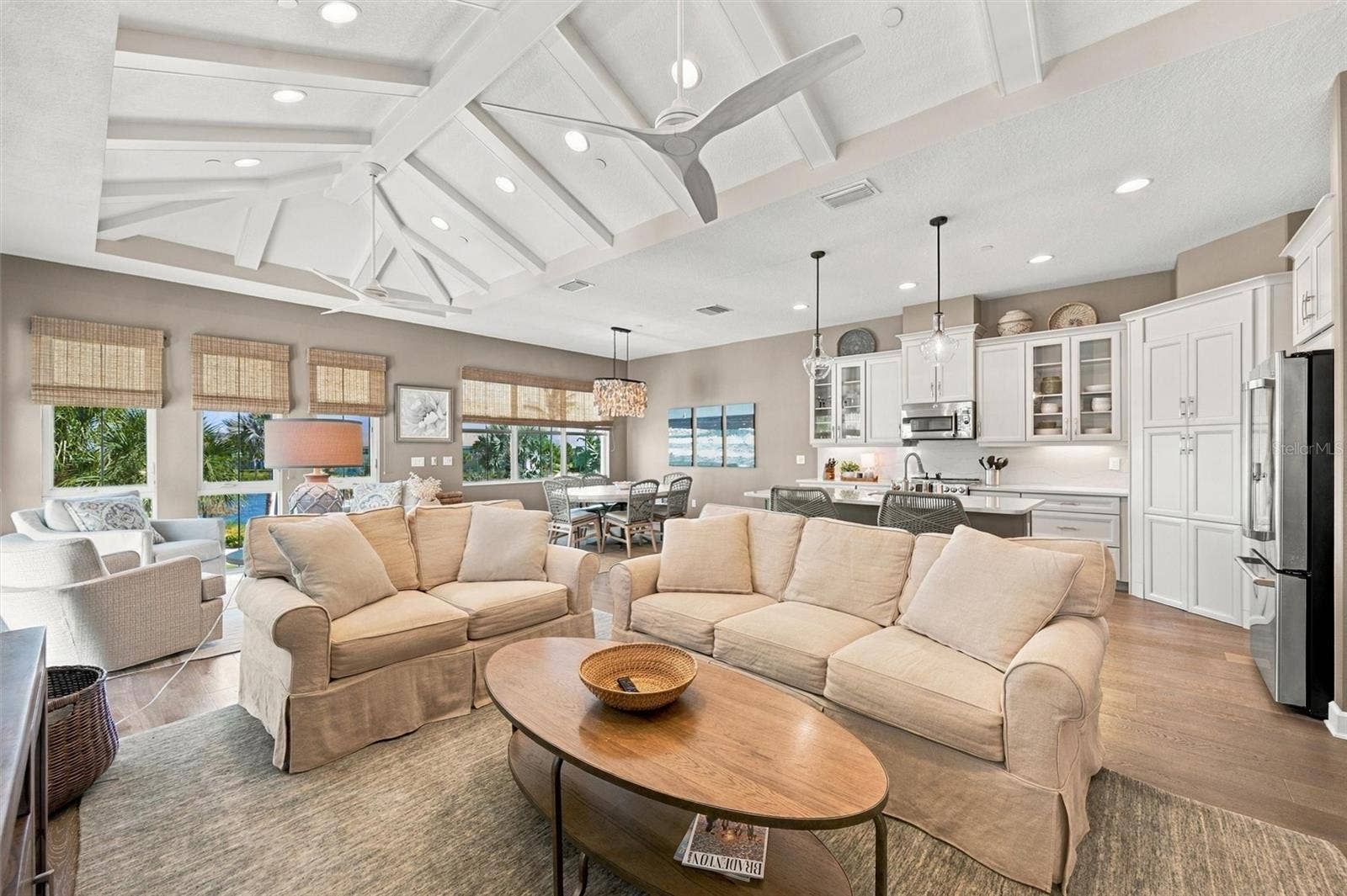 291 COMPASS POINT DRIVE, #201, Bradenton, FL 34209 Enjoy peaceful Sapphire Lake views from this beautifully appointed home, featuring an open-concept floor plan, soaring vaulted ceilings, and Mohawk engineered hardwood flooring.