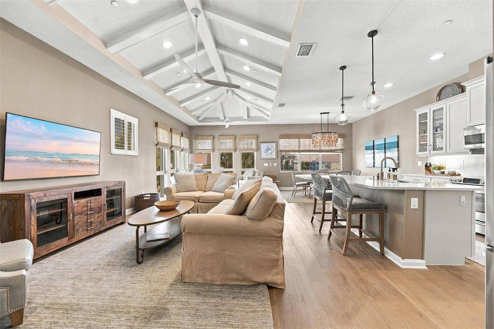 291 COMPASS POINT DRIVE, #201, Bradenton, FL 34209 Turnkey-furnished 2-bedroom, 2-bath Bermuda coach home featuring a versatile bonus roomperfect for a den, home office, or additional bedroom!