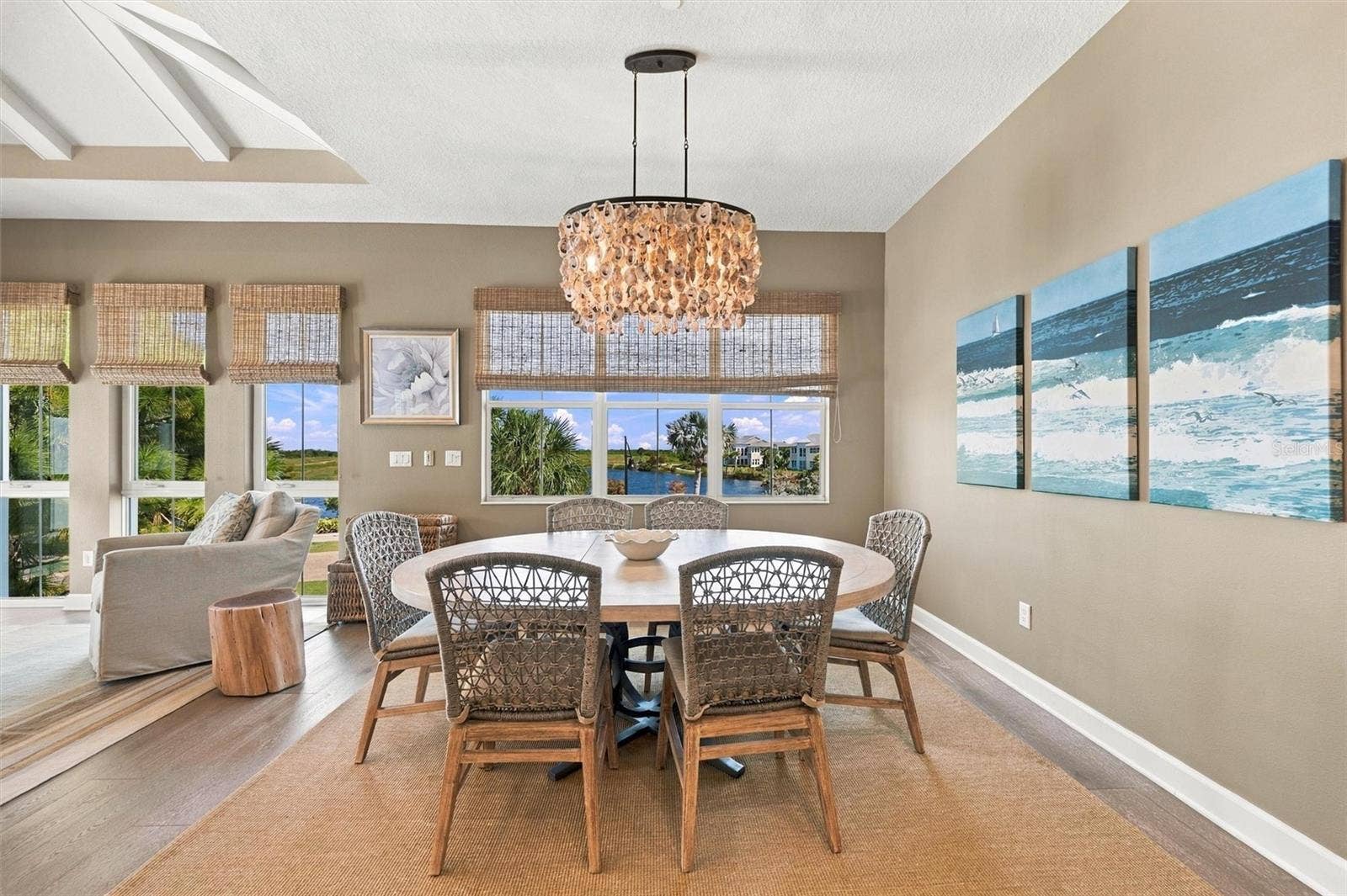 291 COMPASS POINT DRIVE, #201, Bradenton, FL 34209 Enjoy peaceful Sapphire Lake views from this beautifully appointed home, featuring an open-concept floor plan, soaring vaulted ceilings, and Mohawk engineered hardwood flooring.
