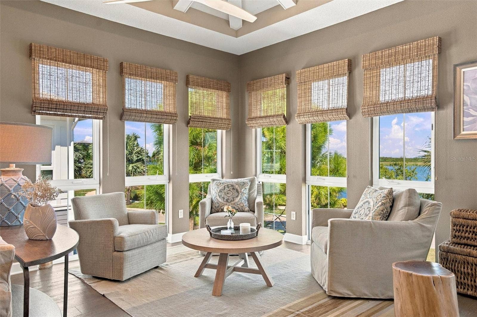 291 COMPASS POINT DRIVE, #201, Bradenton, FL 34209 Enjoy peaceful Sapphire Lake views from this beautifully appointed home, featuring an open-concept floor plan, soaring vaulted ceilings, and Mohawk engineered hardwood flooring.