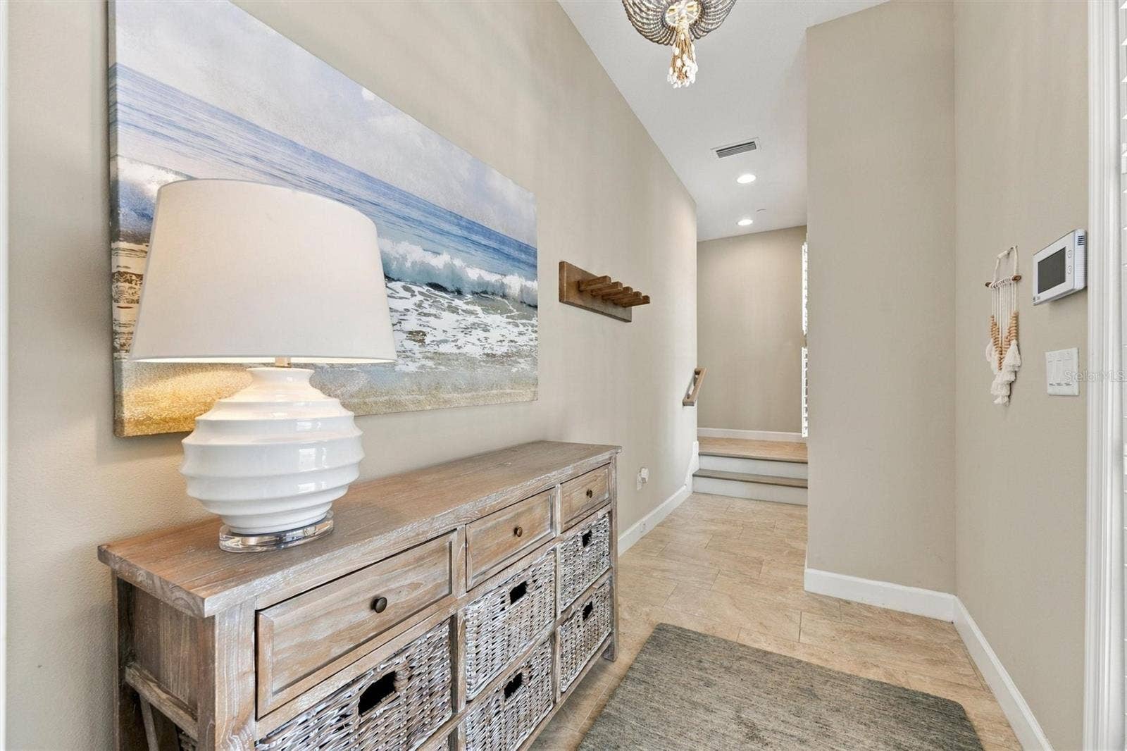 291 COMPASS POINT DRIVE, #201, Bradenton, FL 34209 Welcome through the front entry, with convenient access to the second level by either stairs or elevator.