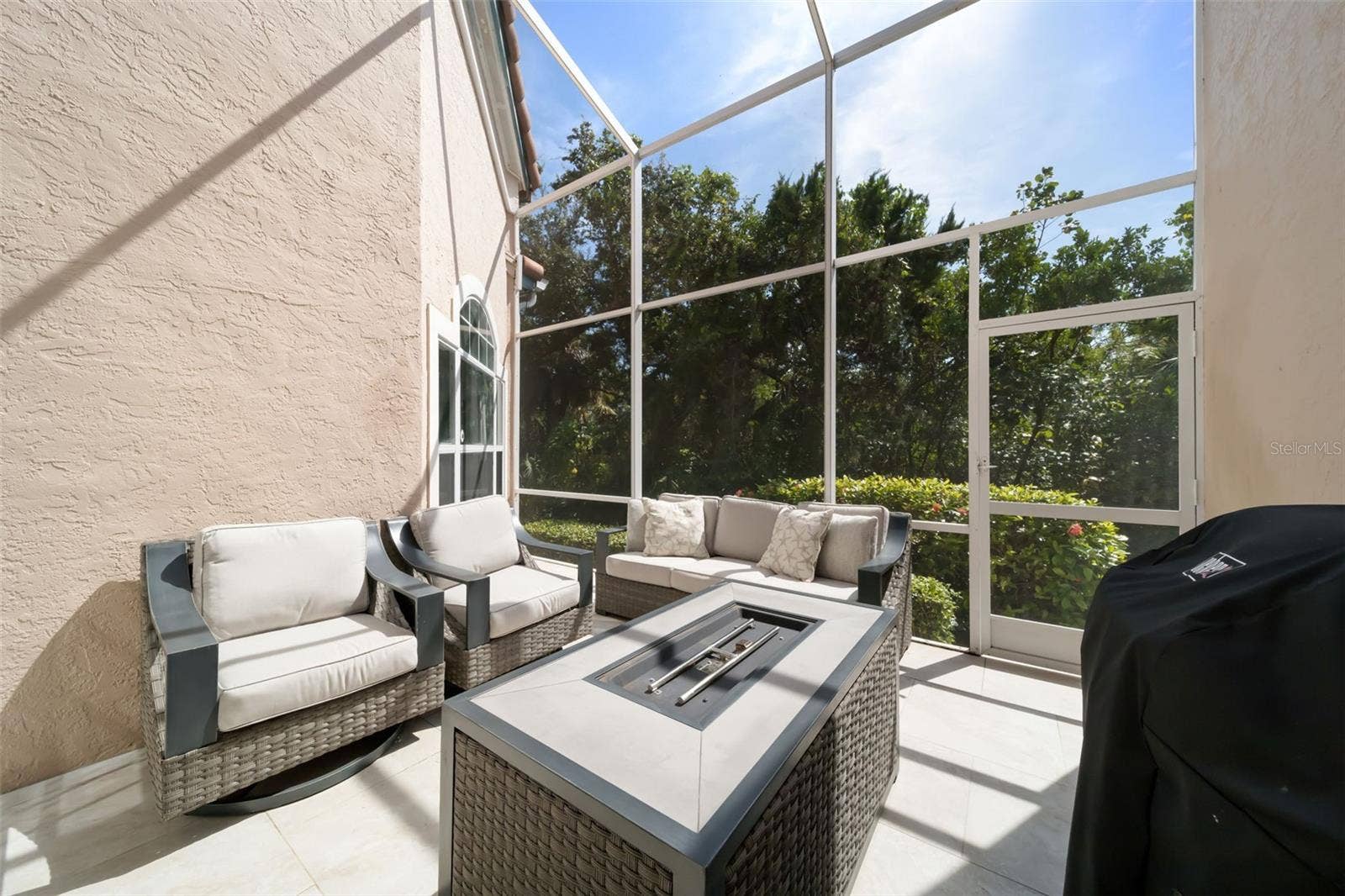 1703 STARLING DRIVE, #1703, Sarasota, FL 34231 Screened in Patio with Fire Pit