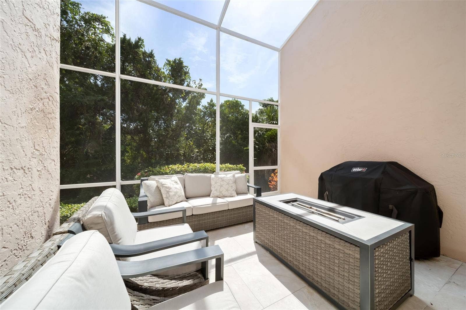 1703 STARLING DRIVE, #1703, Sarasota, FL 34231 Screened in Patio with Fire Pit