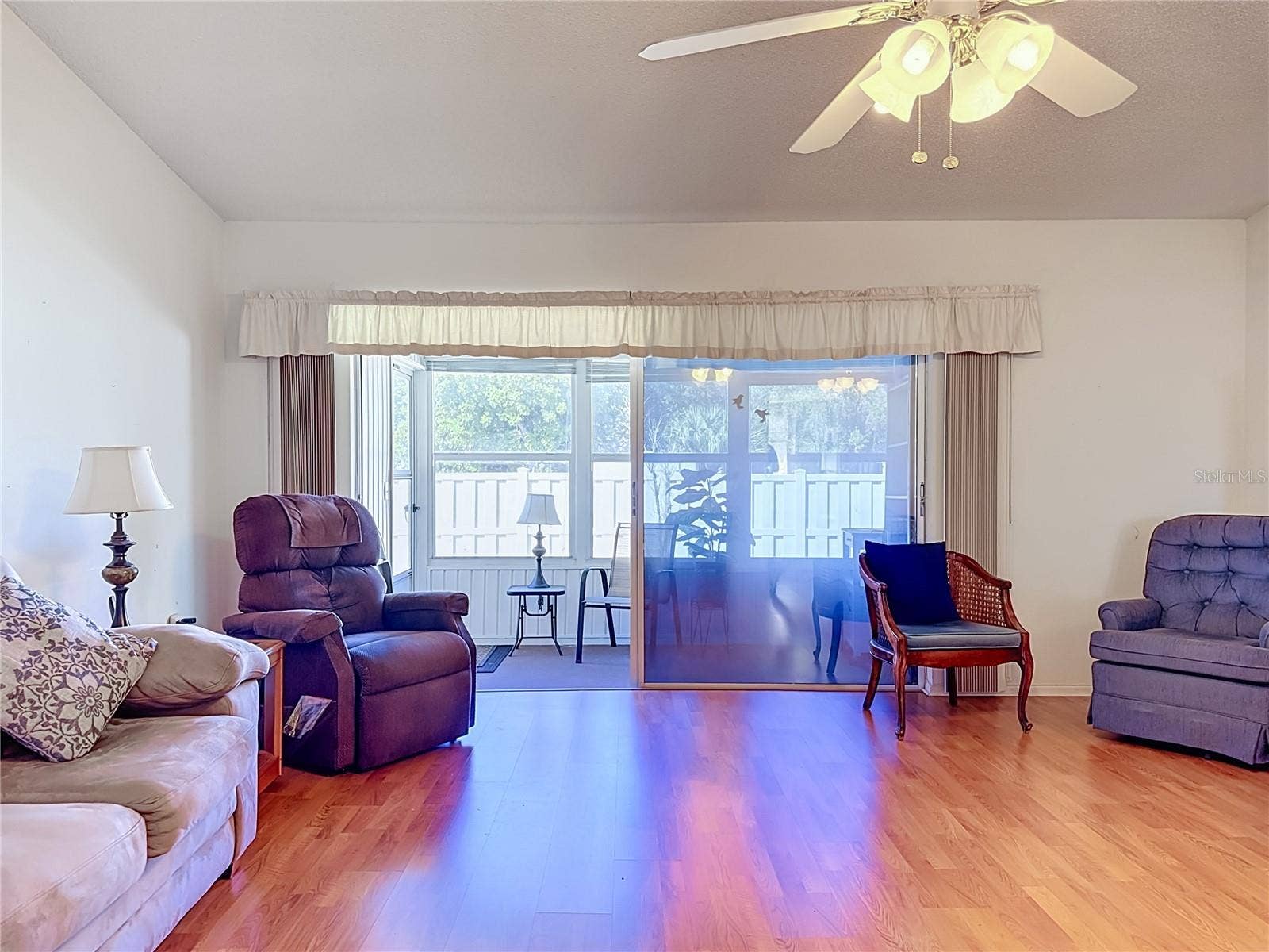 Living room with attached sunroom.