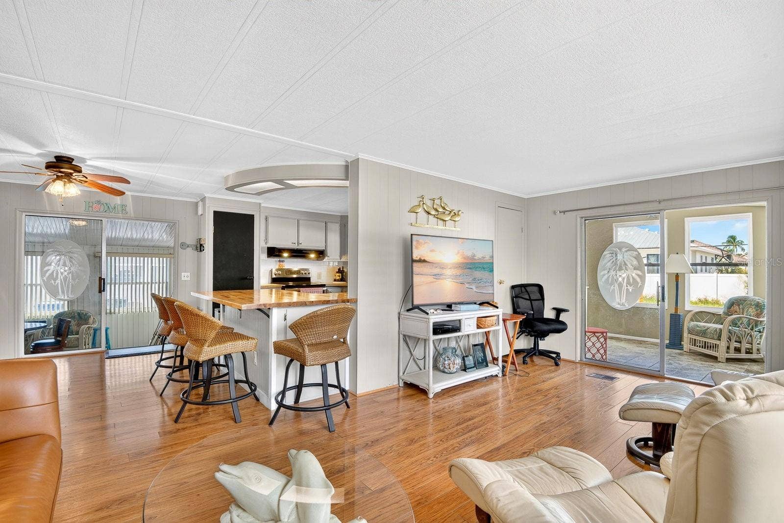 Living area showing Dining and kitchen in back