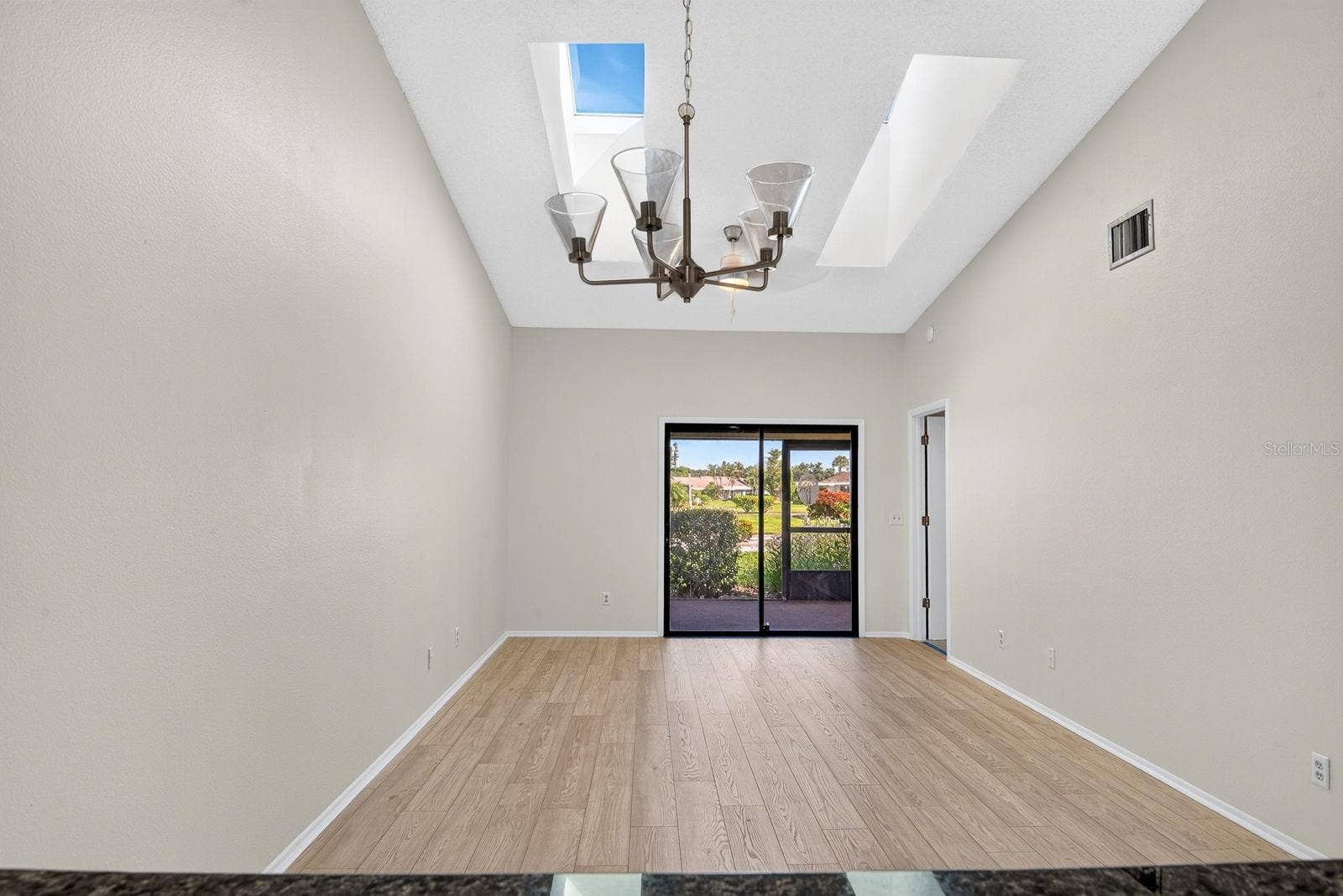 2930 64TH STREET W, #130, Bradenton, FL 34209 Living and Dining area wide open with skylights