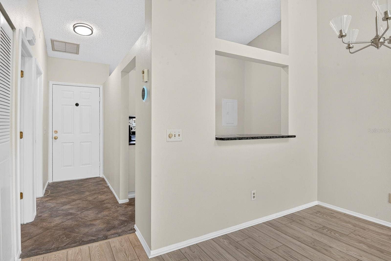 2930 64TH STREET W, #130, Bradenton, FL 34209 Dining area with Kitchen behind and entryway