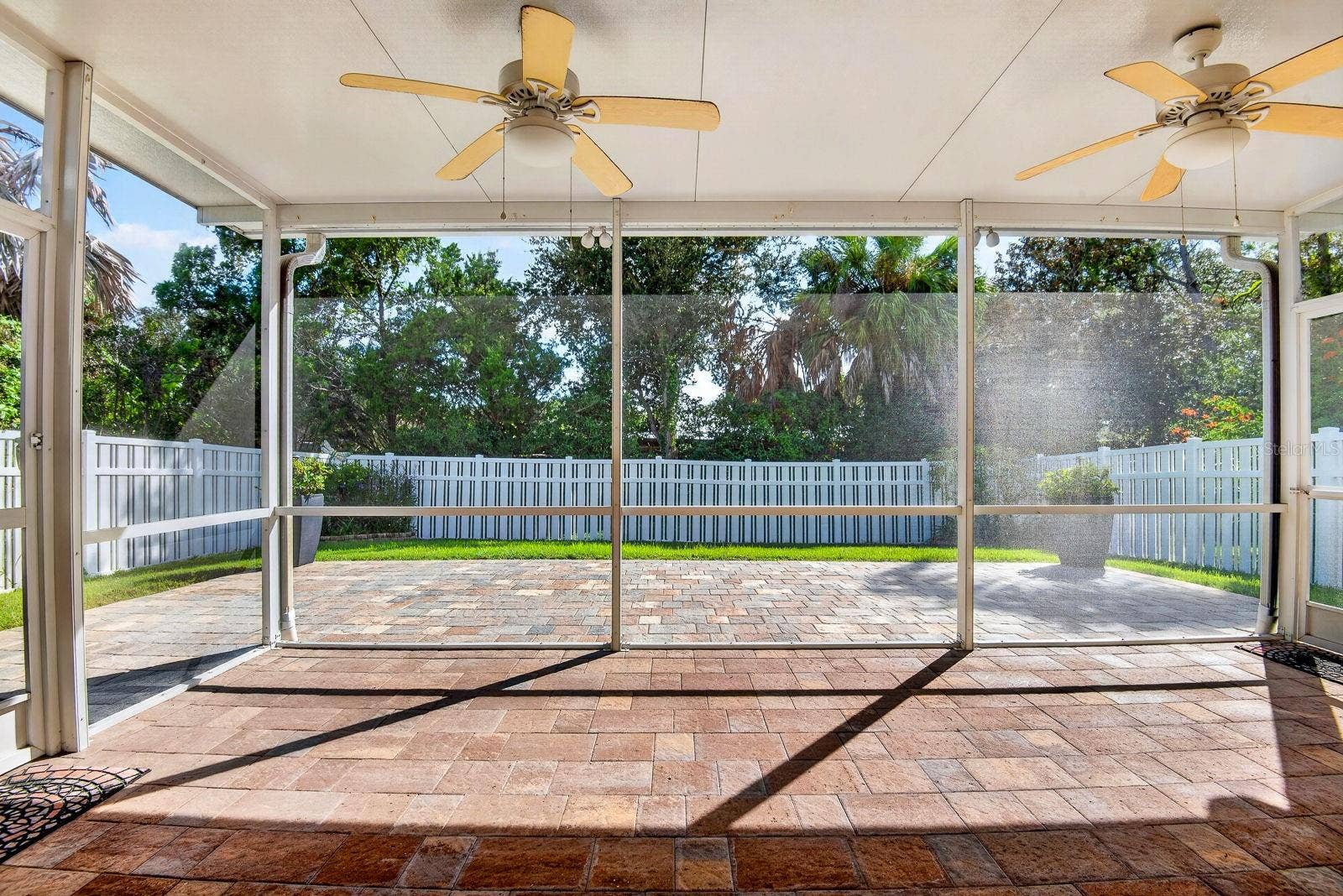 5312 AQUA BREEZE DRIVE, Bradenton, FL 34208 Large screened in Lanai facing out with extended pavers outside