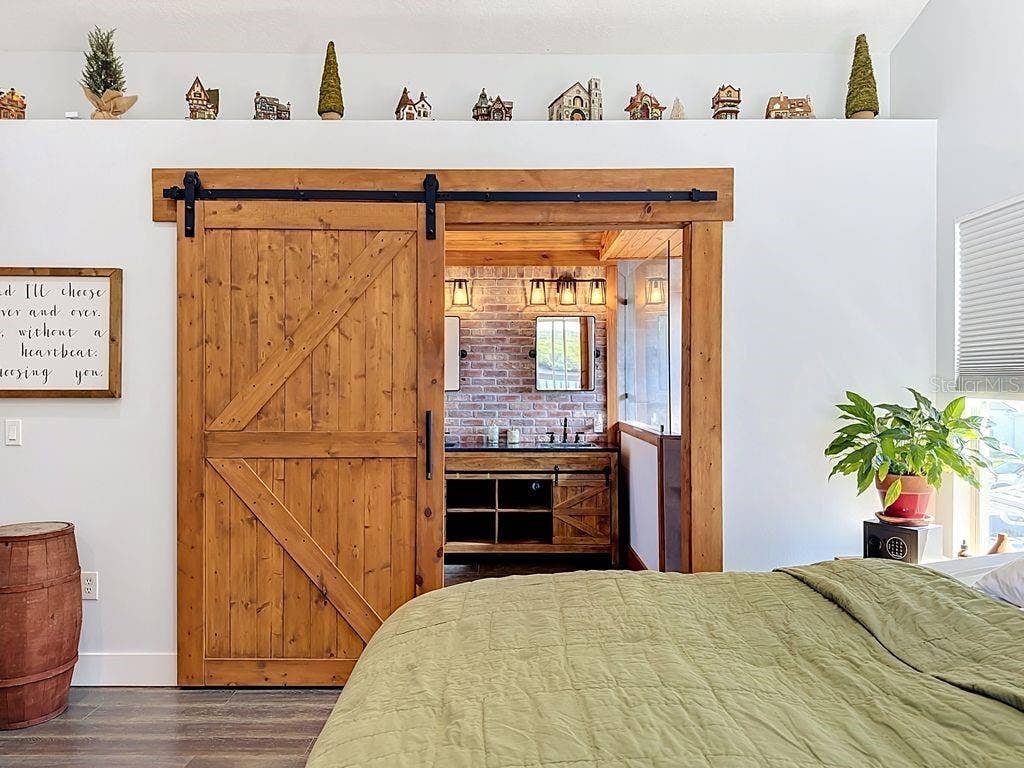 Bradenton, FL 34208 Barn Door and Brick Accent Wall