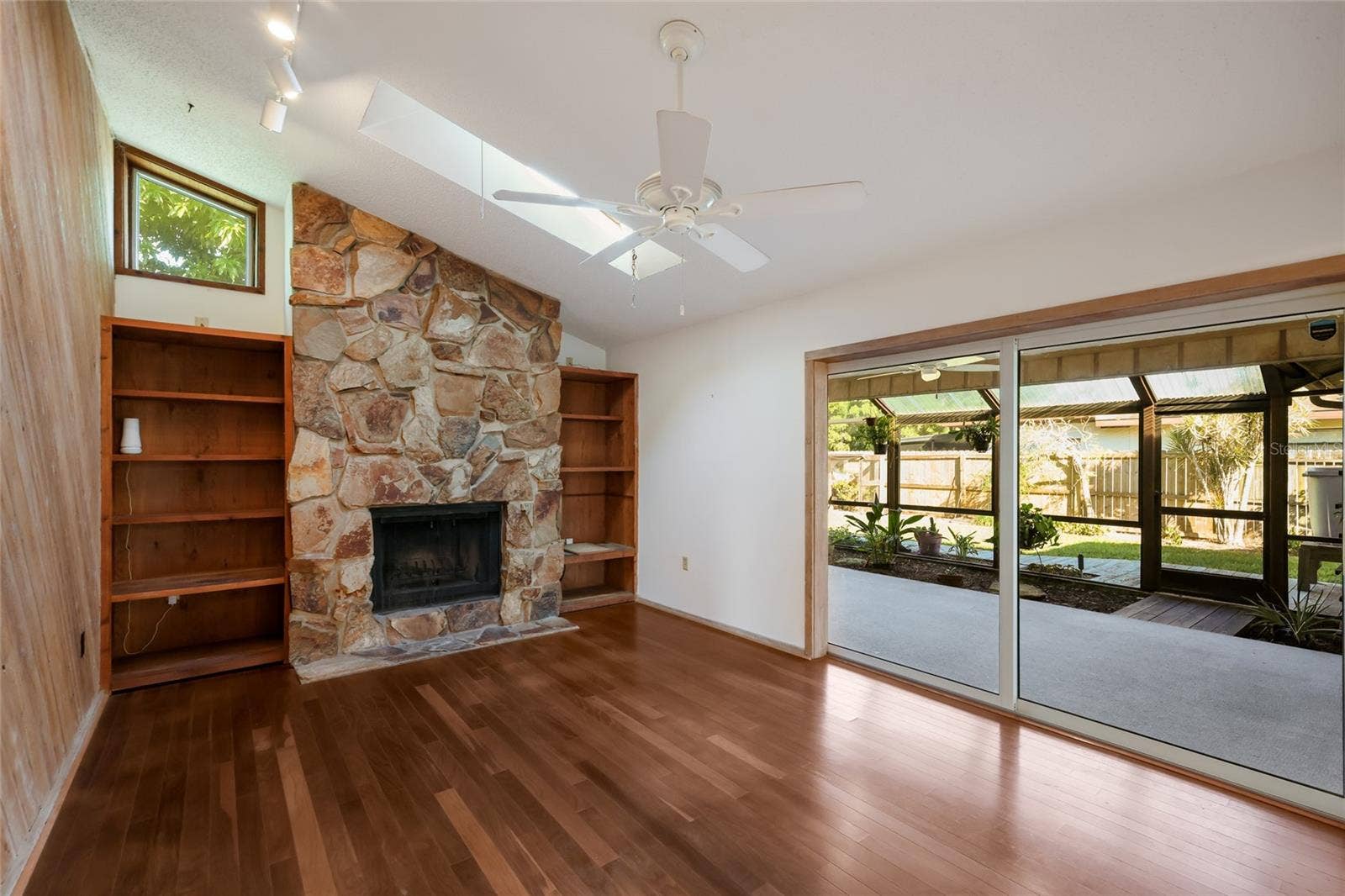 204 46TH STREET NW, Bradenton, FL 34209 Family room w/ impact sliding pocket doors to screened in lanai