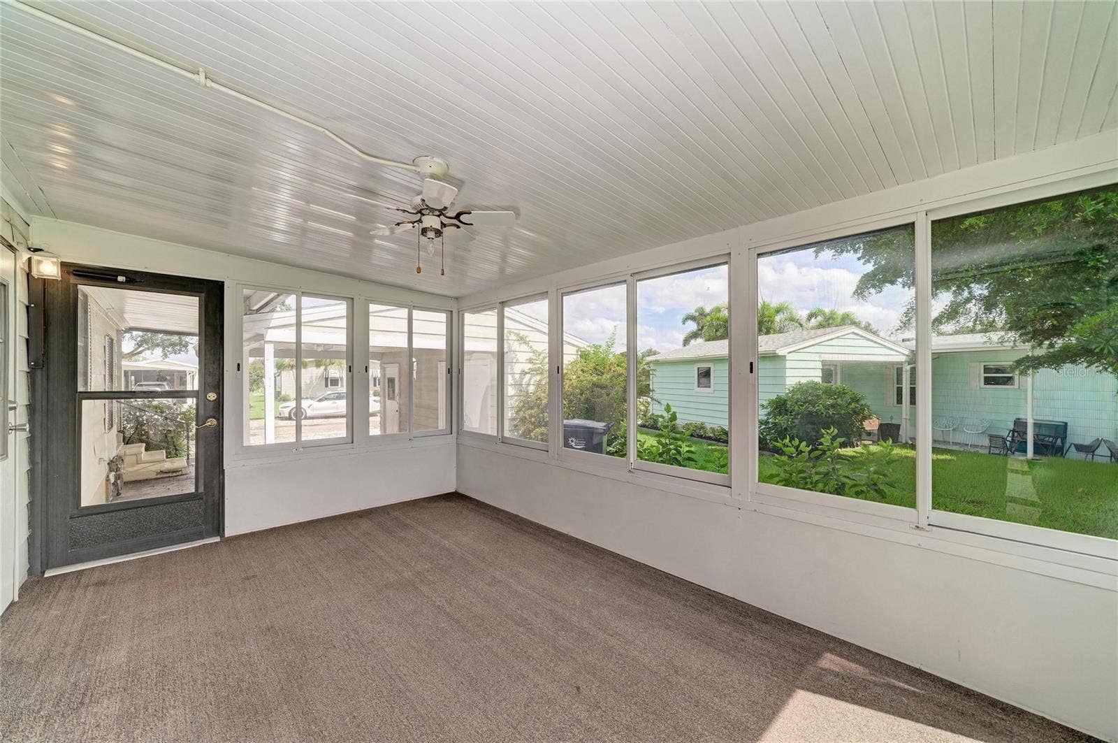 42 MEADOWLARK CIRCLE, Ellenton, FL 34222 View of sunroom looking out to carport