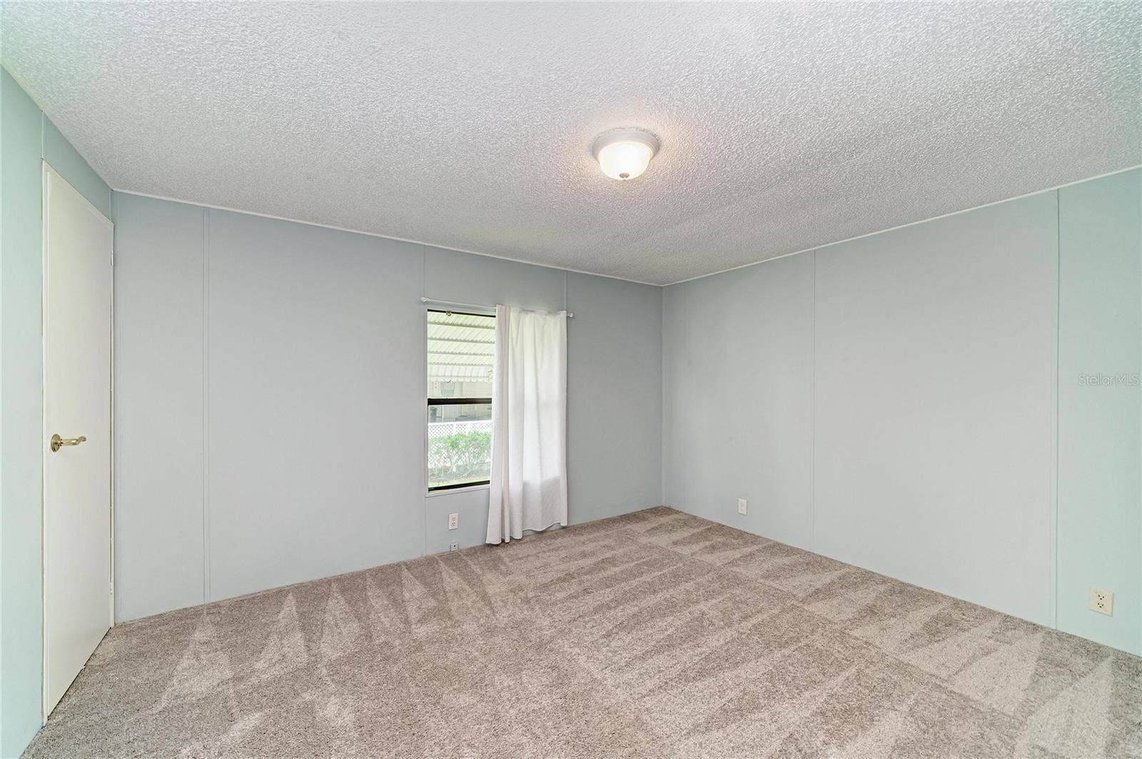 42 MEADOWLARK CIRCLE, Ellenton, FL 34222 Bedroom 2 with newer carpet. Good size closet